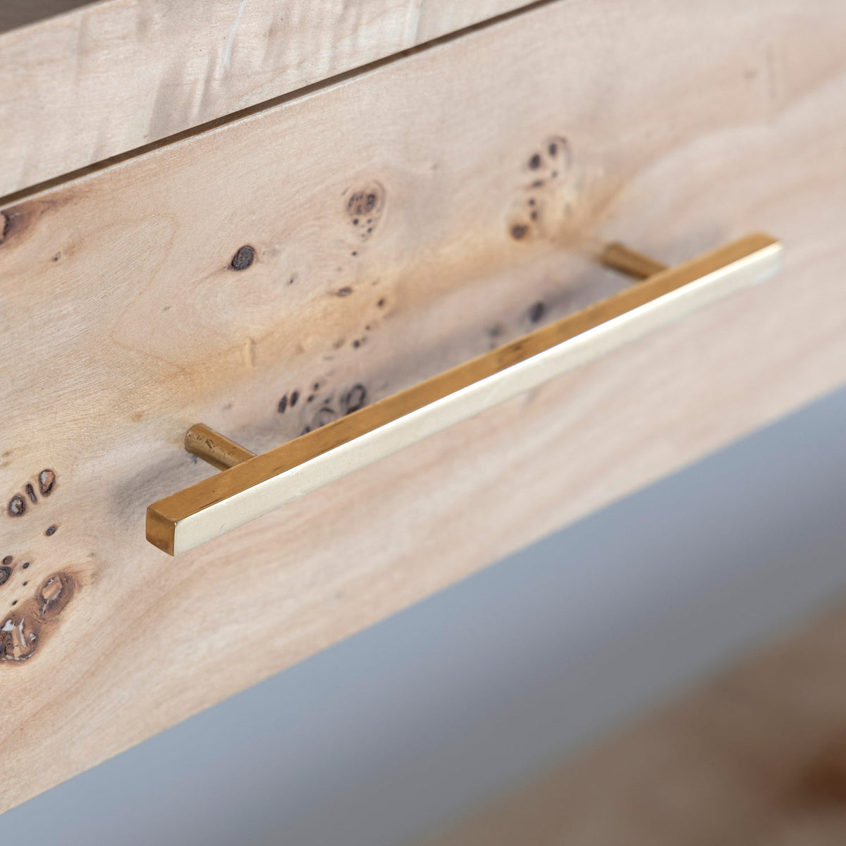 Close-up detail of the Co. House Designs Wesley Burl Light Console Table (view 2)