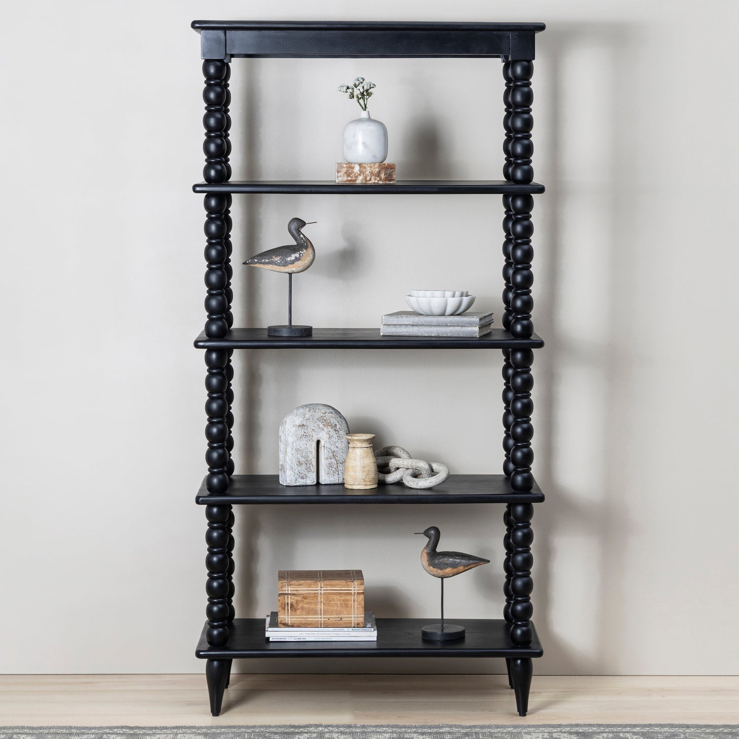 Co. House Designs Spindle Black Tall Bookcase styled in a room setting