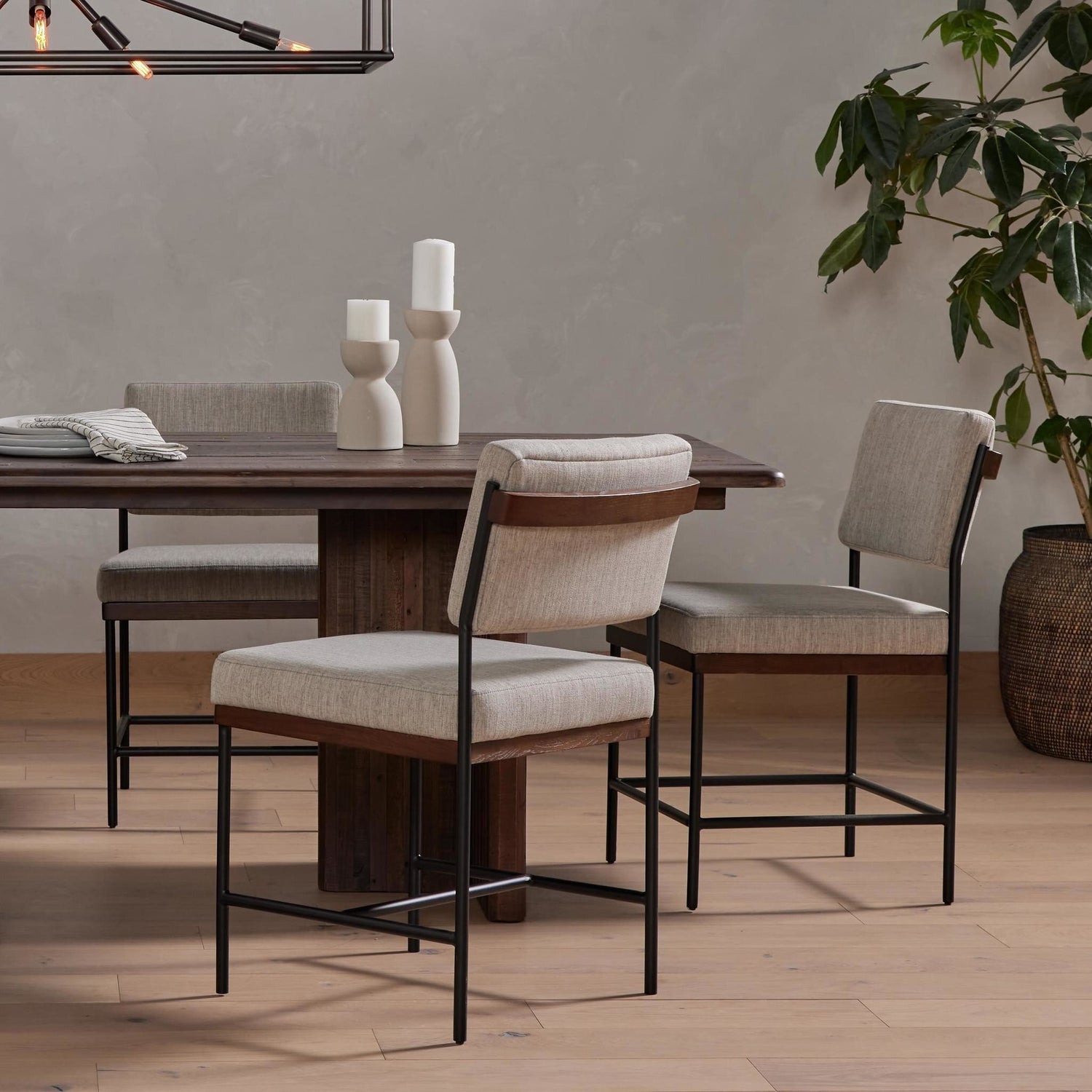 Four Hands Benton Savile Flannel Dining Chair styled in a room setting