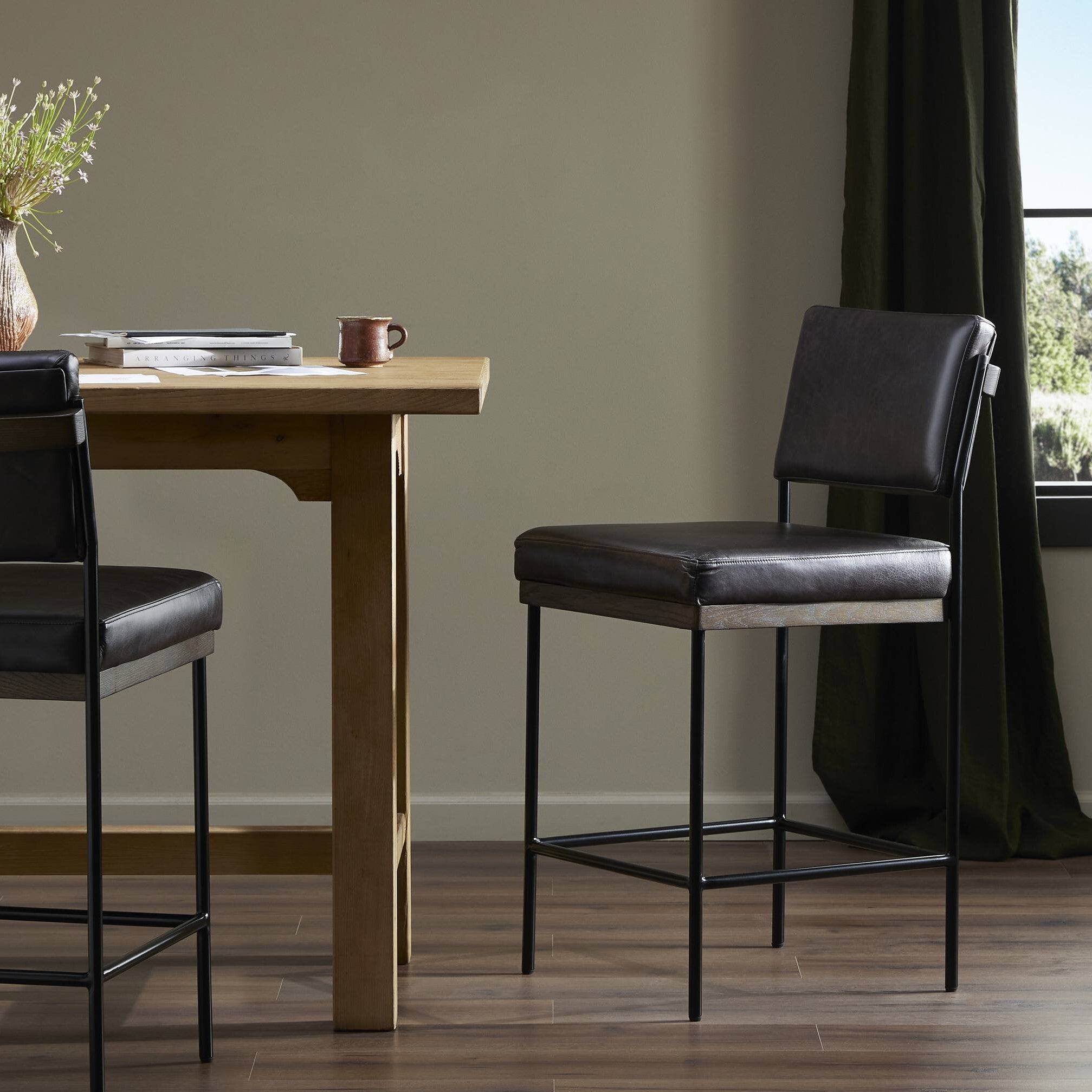 Four Hands Benton Sonoma Black Bar Stool styled in a room setting