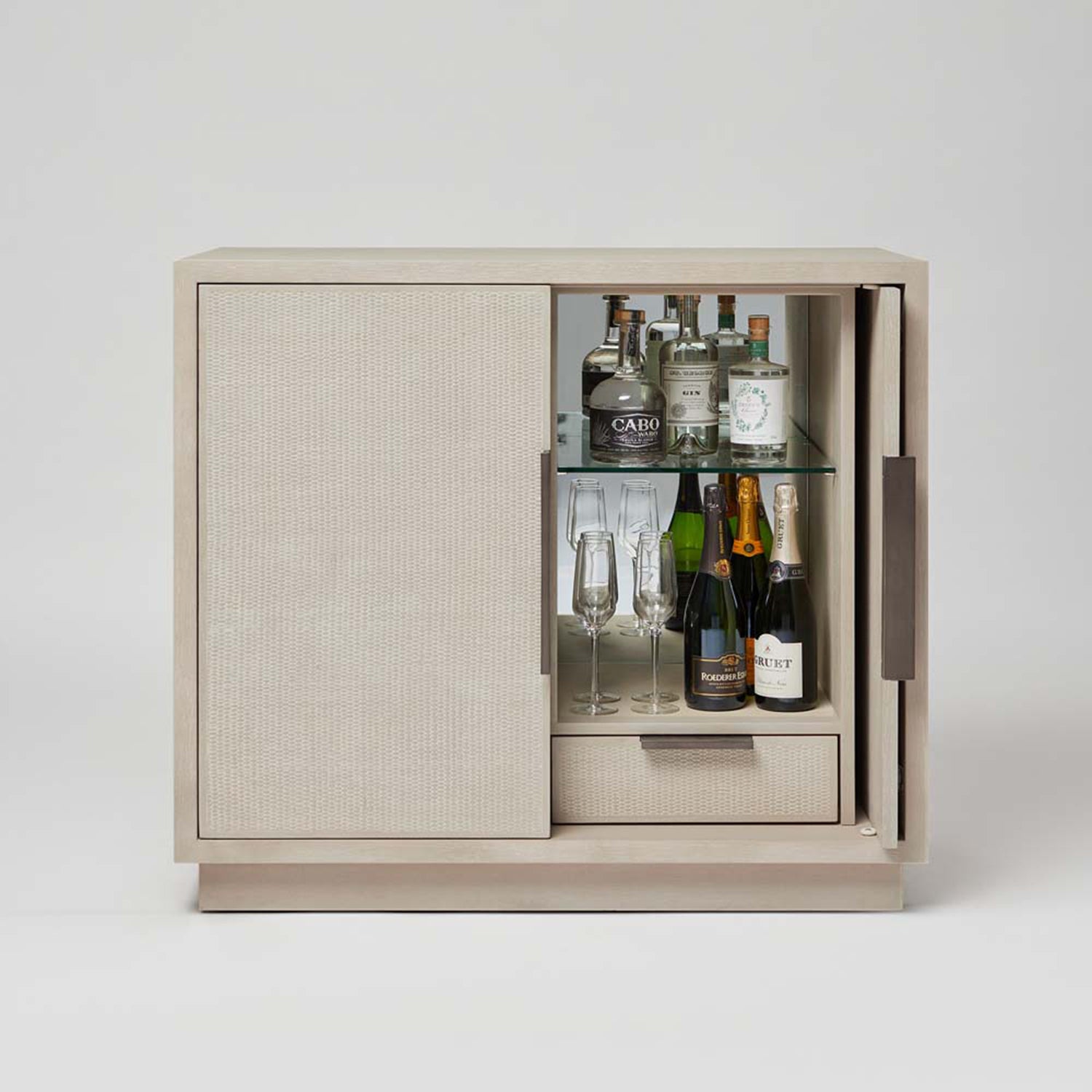 Holmes Cliffside Bar Cabinet in oak cliffside finish, styled in a room setting