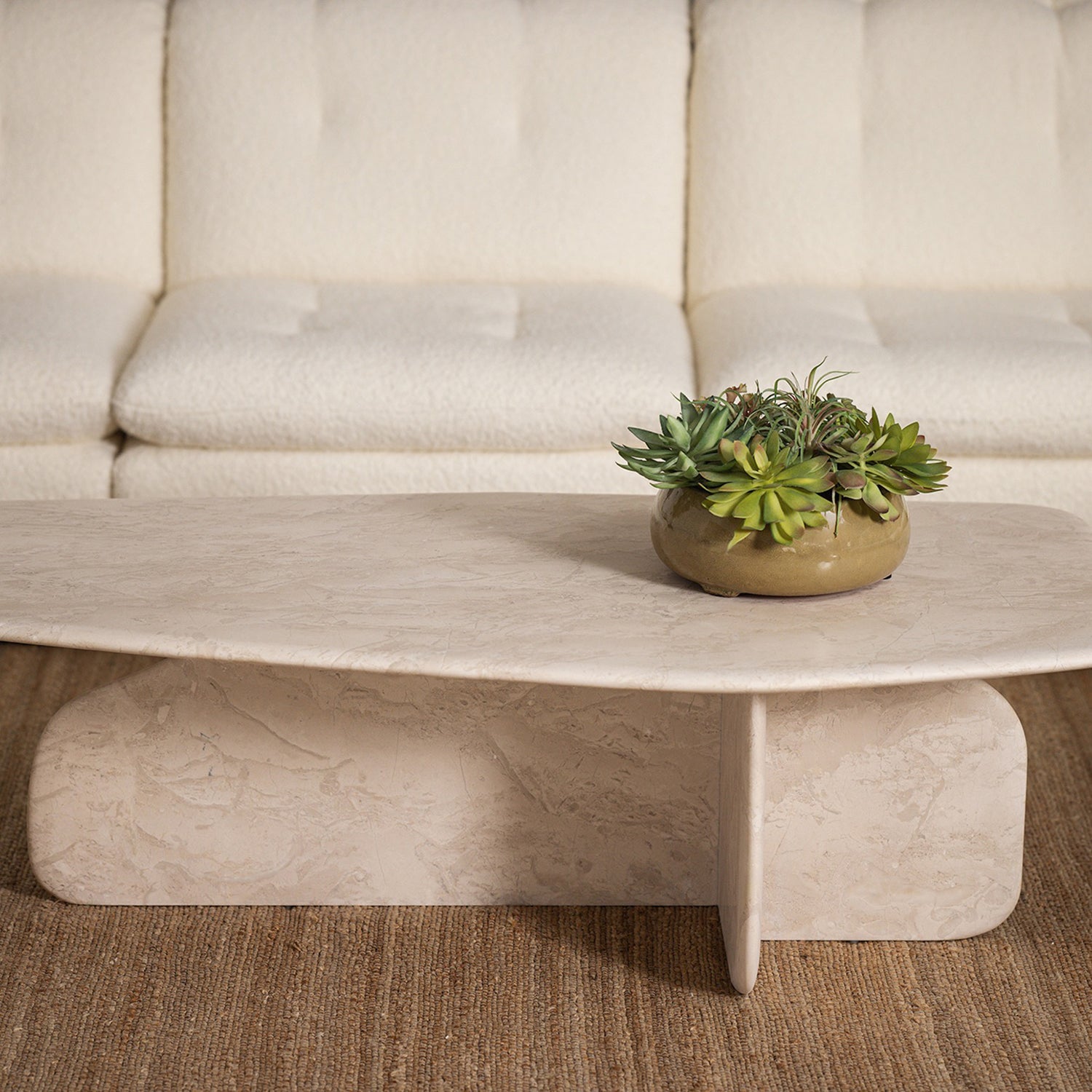 Celine Biscuit Cocktail Table styled in a room to show its coffee table scale and proportions