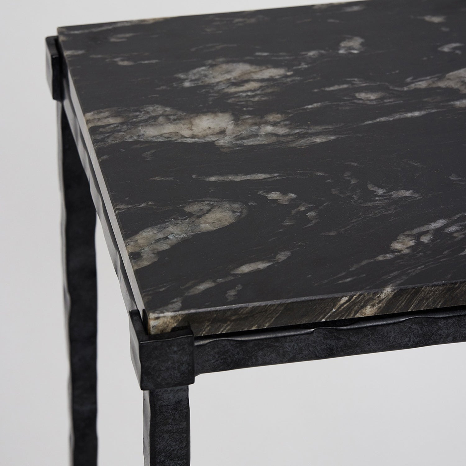 Detail of the marble top on the Interlude Home Reese Hammered Charcoal Pedestal