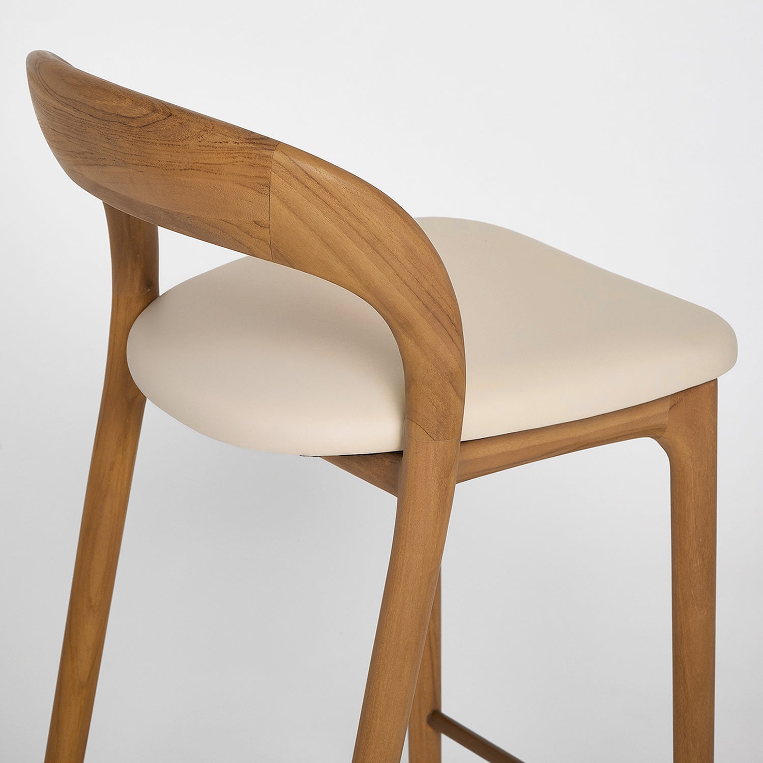 Close-up of the Teak finish on the Interlude Home Felix Tawny Bar Stool Set of 2