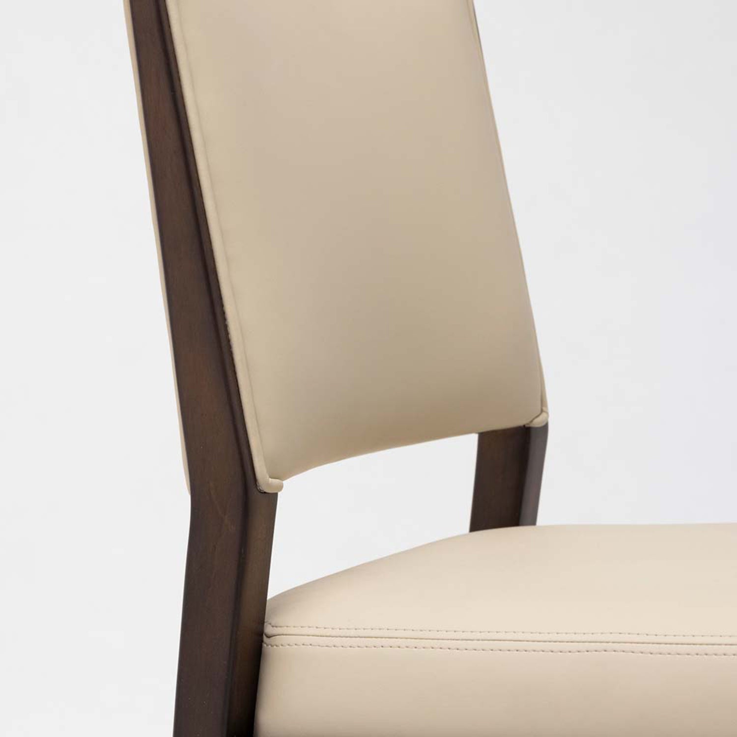 Close-up of the Wood finish on the Interlude Home Ludlow Cream Latte Dining Chair Set of 2