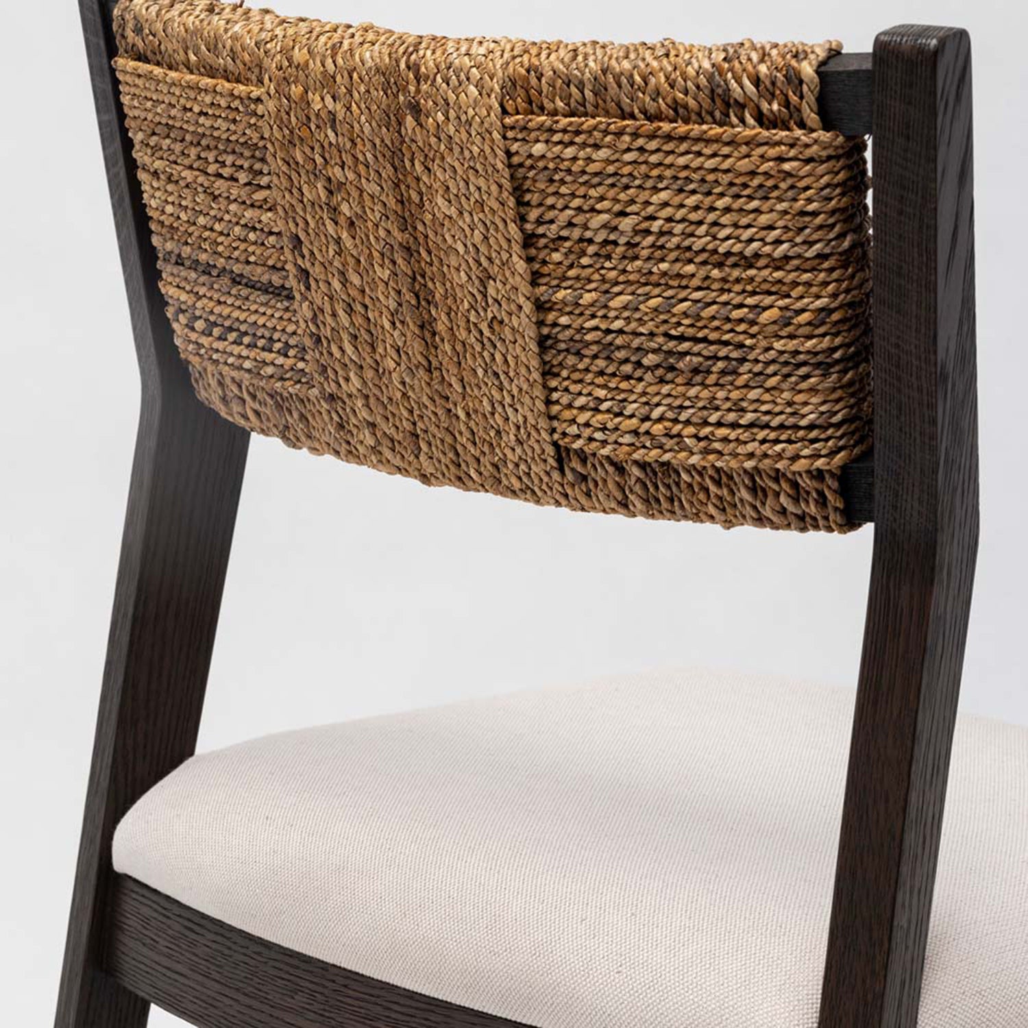 Close-up of the Oak finish on the Interlude Home Colony Carob Dining Chair Set of 2