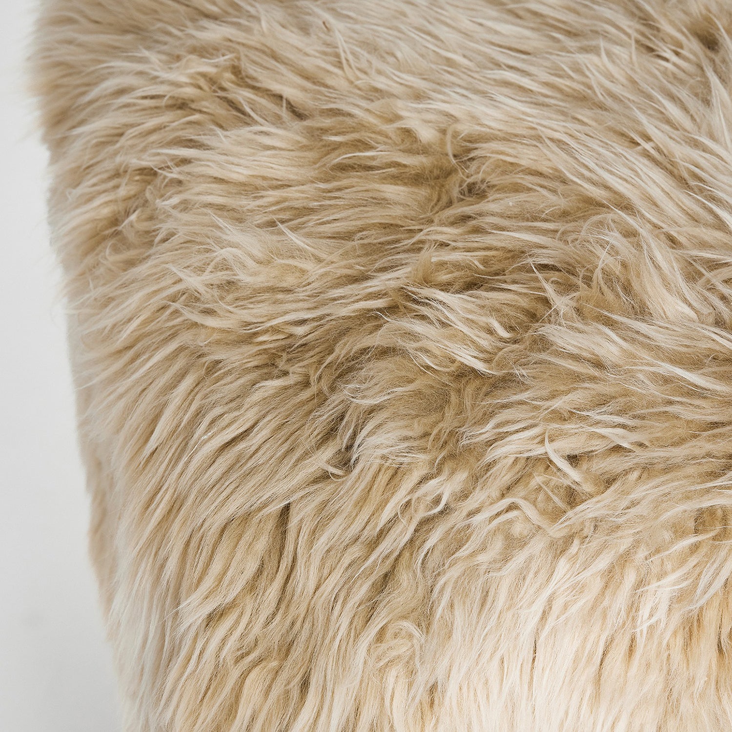 Detail of the upholstered top on the Interlude Home Noah Autumn Brown Stool