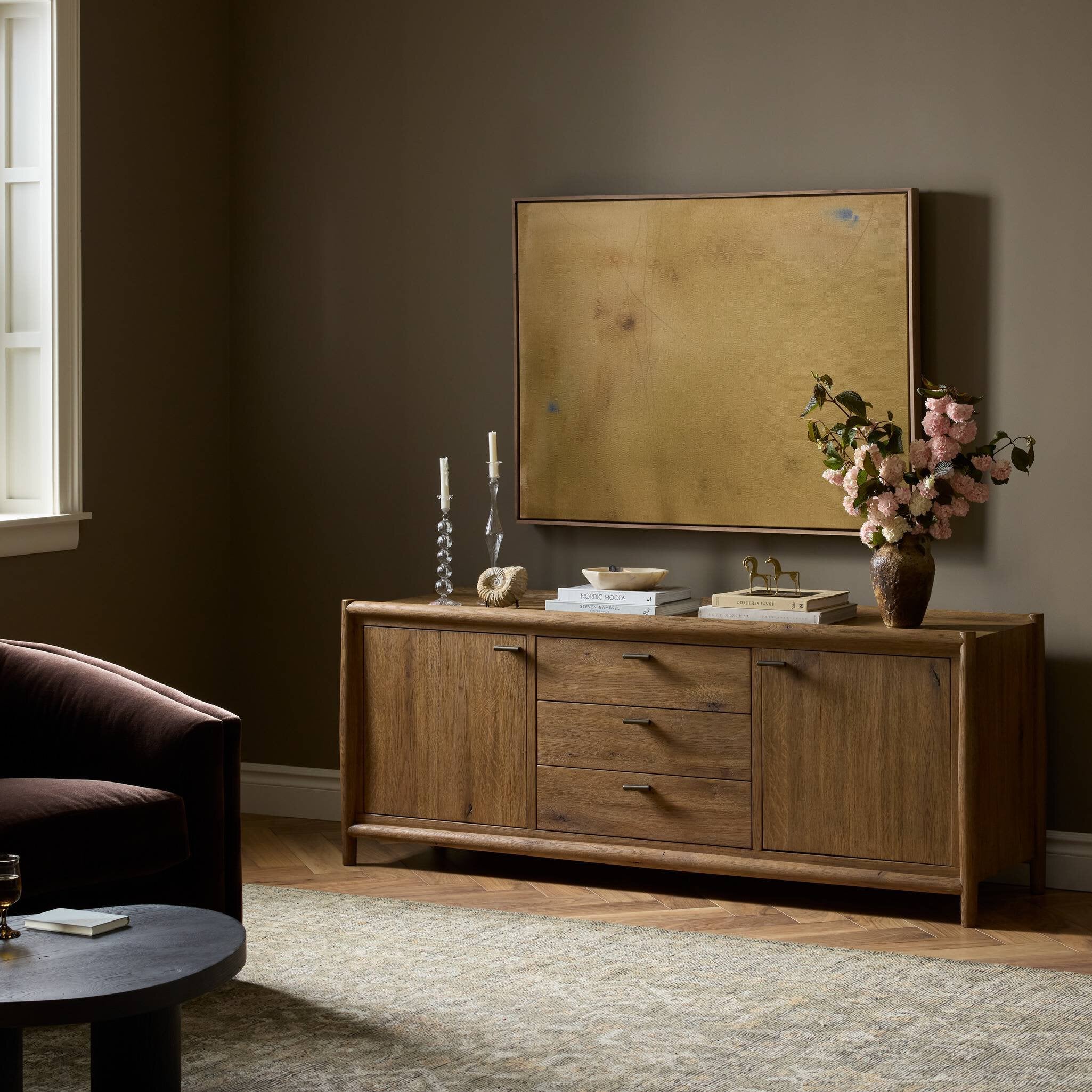 Four Hands Glenview Weathered Oak Media Console styled in a room setting