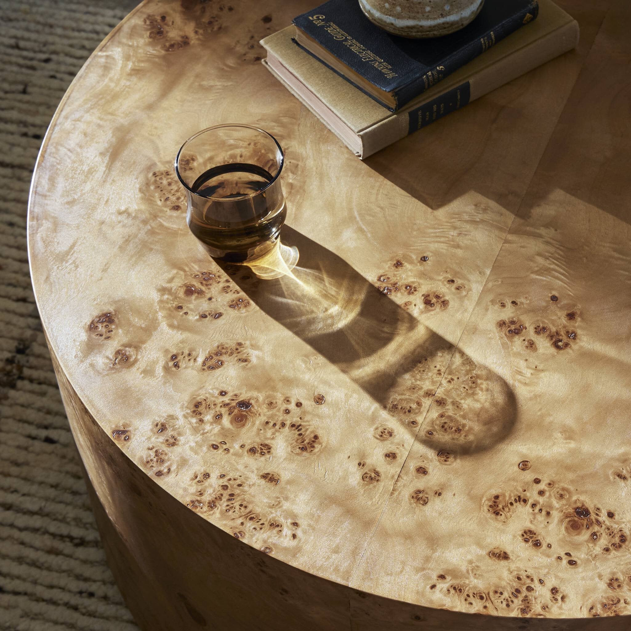 Four Hands Caya Caramel Burl Coffee Table surface close-up
