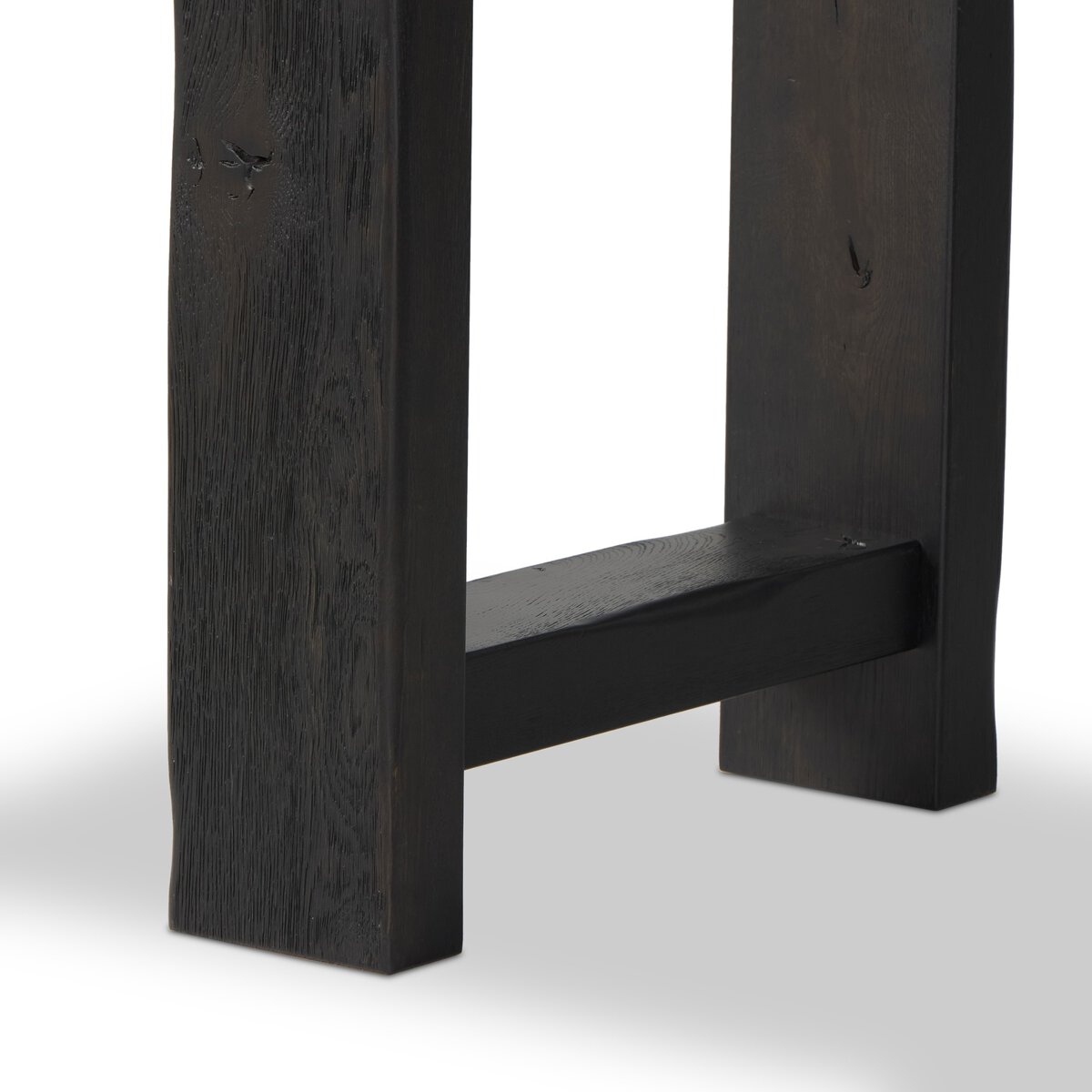 Four Hands Matei Console Table in smoked black solid oak with through-tenon joints, close-up detail of tenon joint, view 3