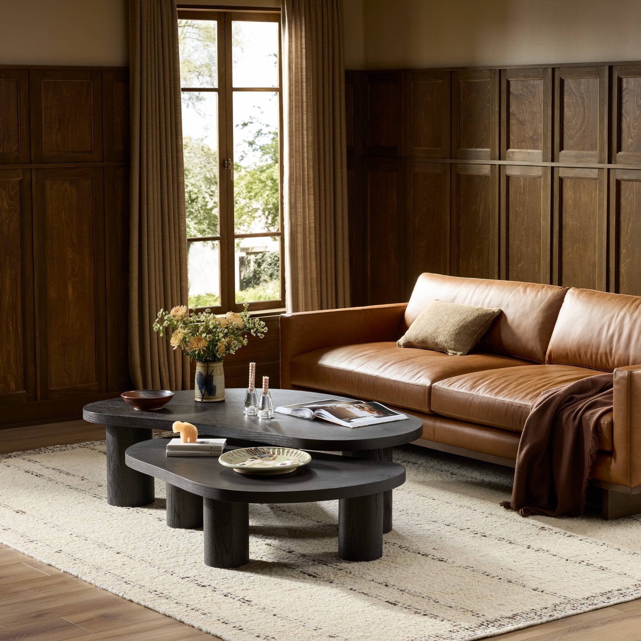 Four Hands Joji Aged Black Nesting Coffee Table styled room setting