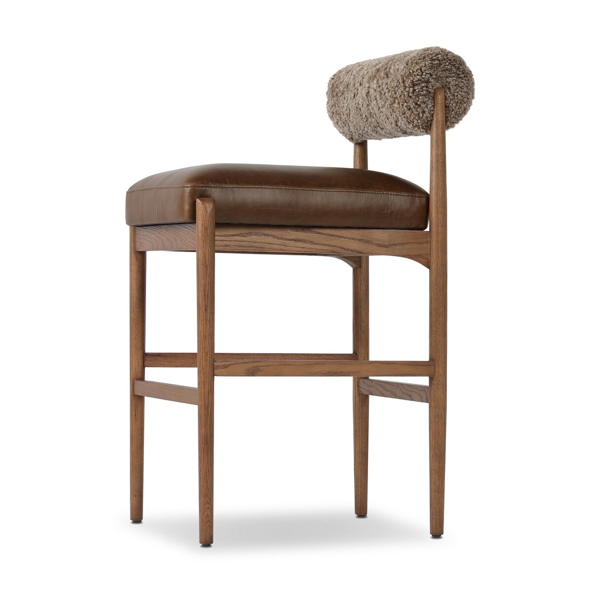 Four Hands Jazelle Havana Brown Bar Stool with leather and shearling, close-up detail of shearling seat, view 1