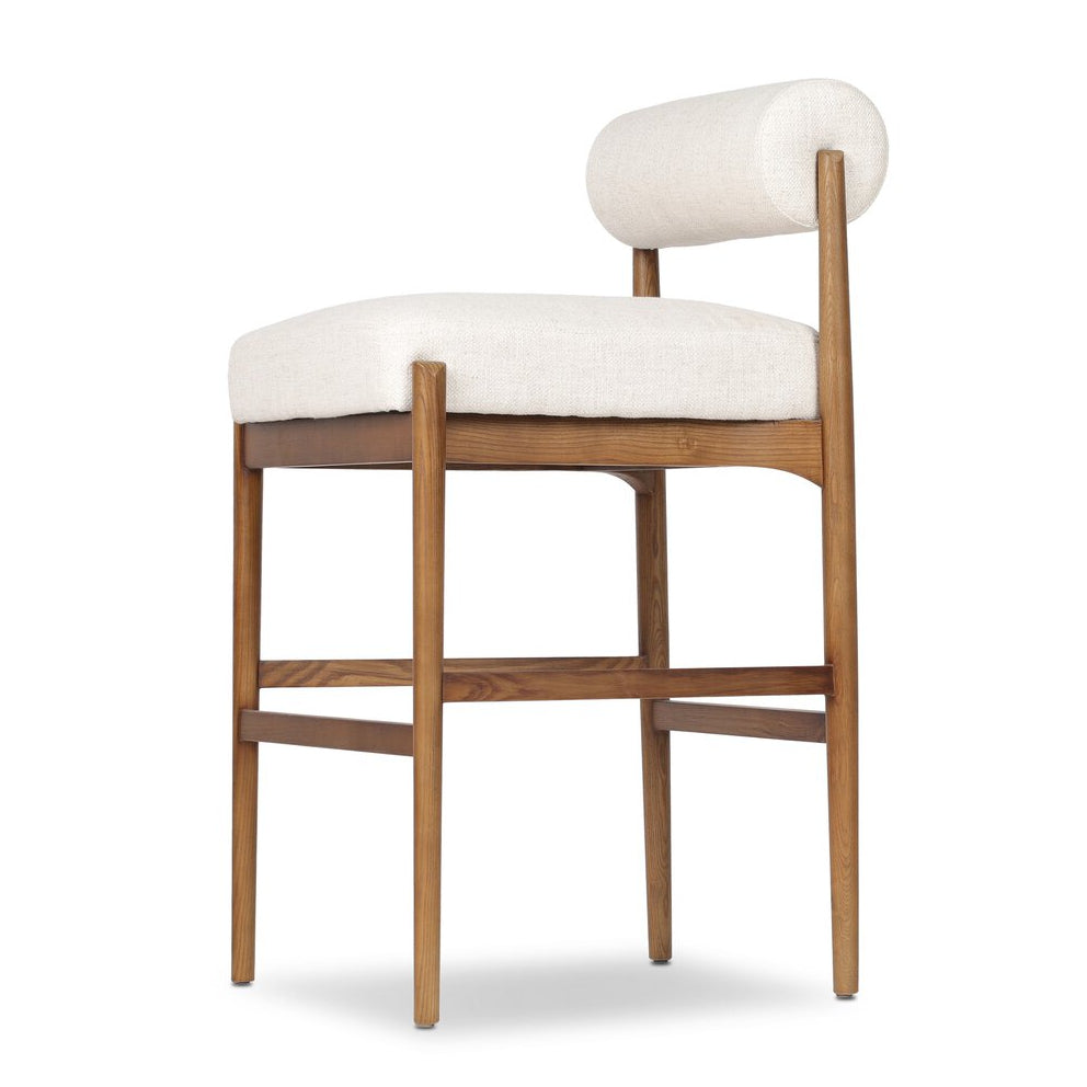 Four Hands Jazelle Dover Crescent Bar Stool Set of 2 on tan ash, close-up detail of cylinder back