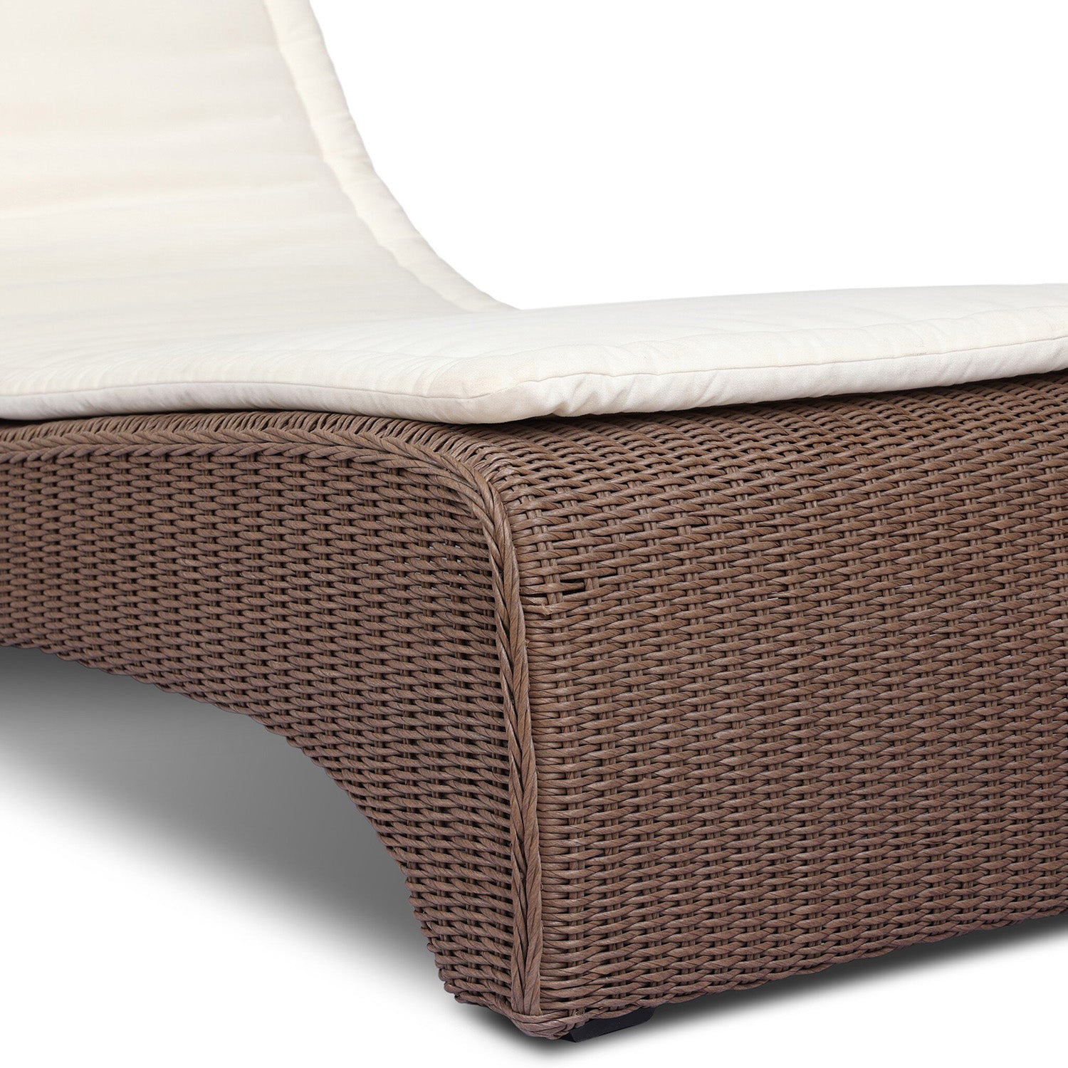 Four Hands Mazu Outdoor Chaise in tanned weave with salt cushion, close-up detail of woven base, view 1