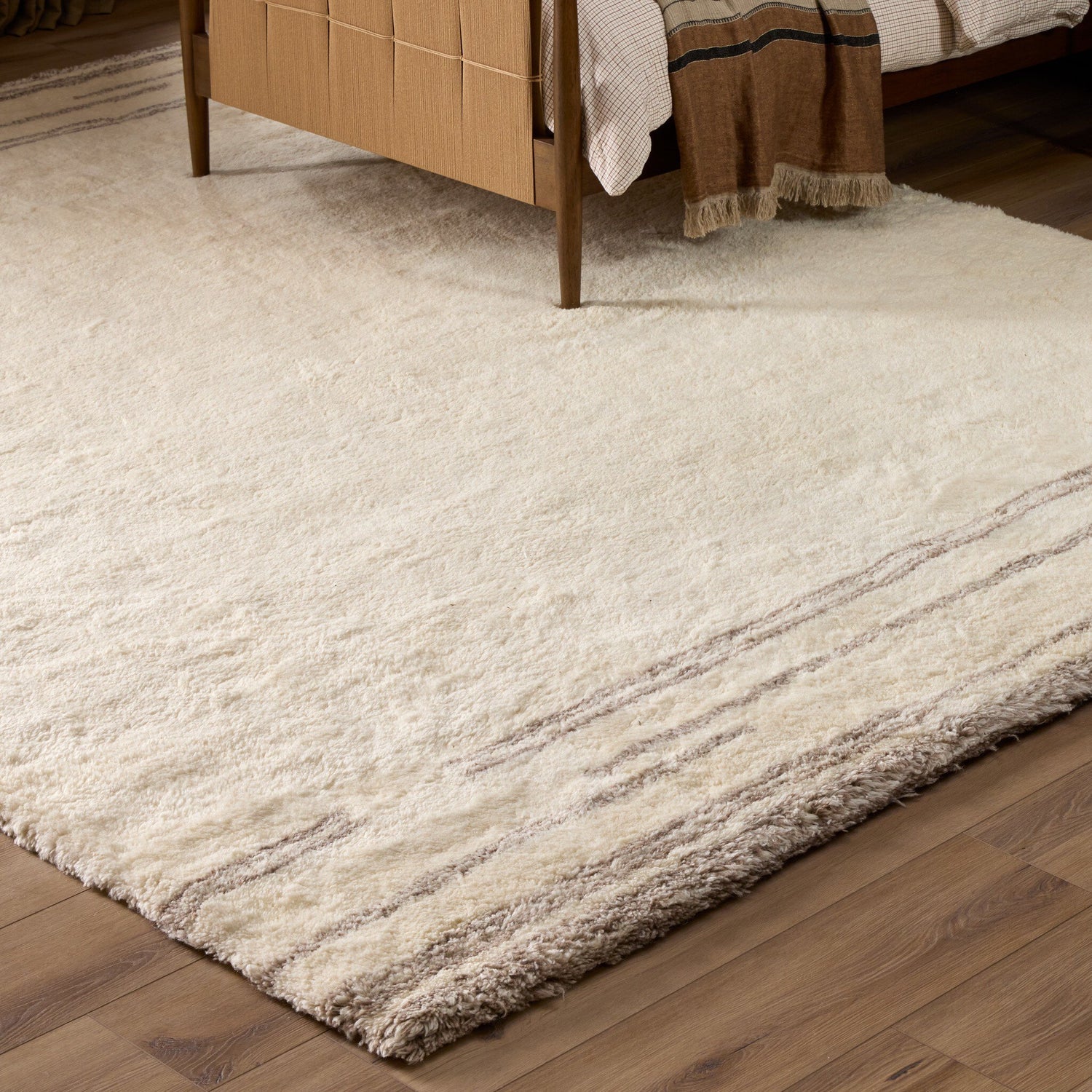 Four Hands Marbella Marbella Ivory Hand-Knotted Rug — in a styled room setting