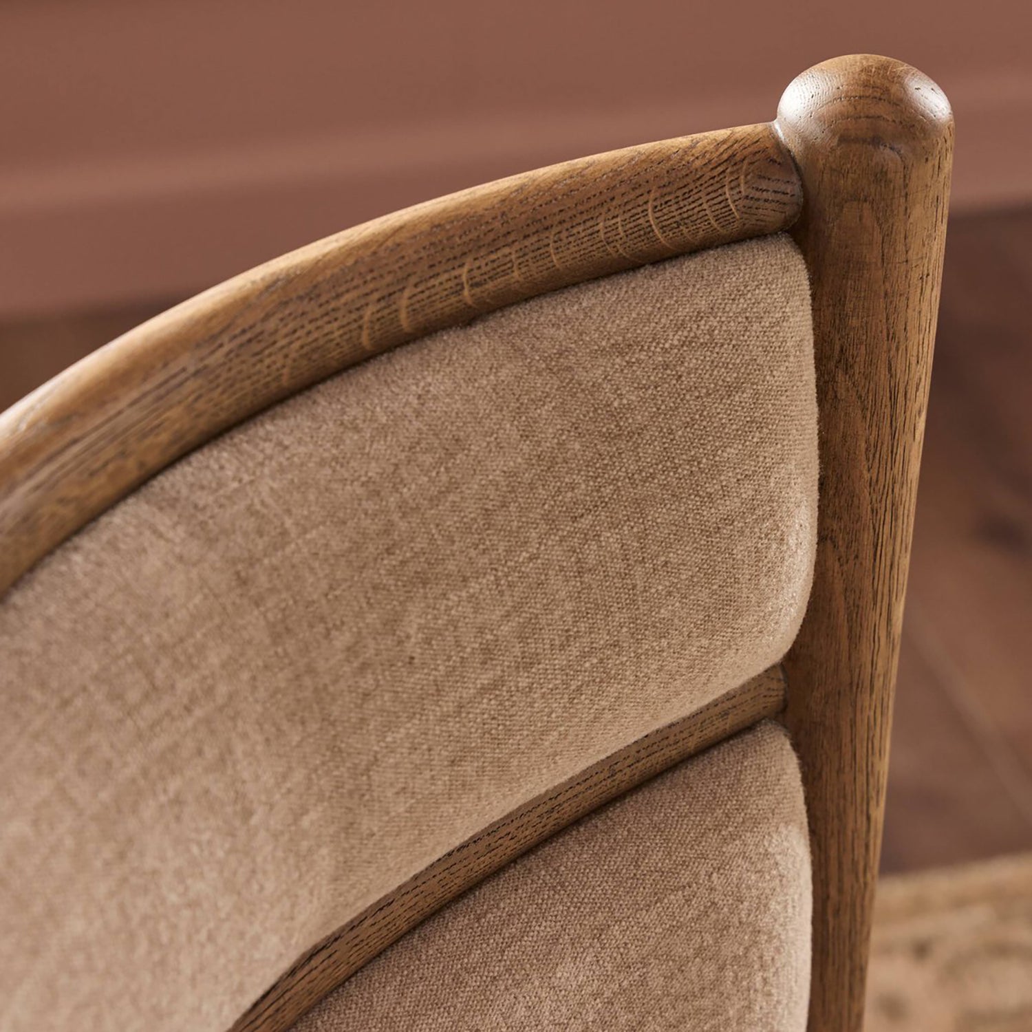 Four Hands Artie Dining Chair in Laughlin Natural on amber oak, close-up detail of tufted channeling, view 1