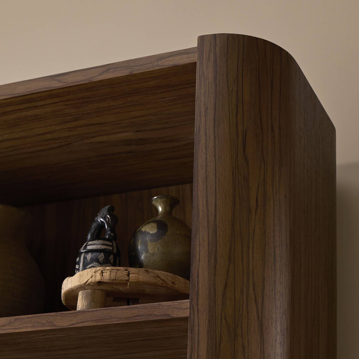 Four Hands Limba Bookcase in medium brown limba veneer, close-up detail of wood grain, view 1