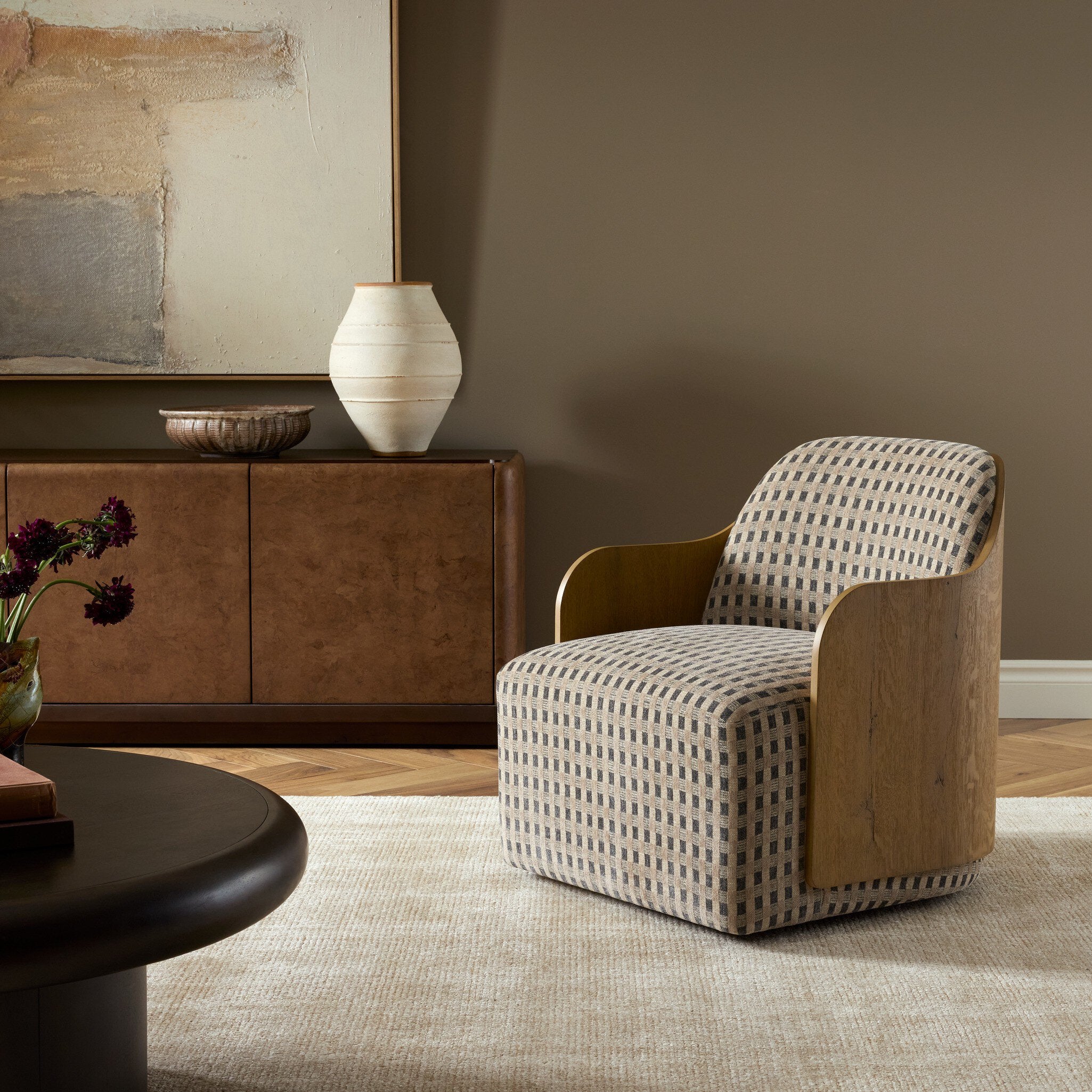 Four Hands Hemphill Firefinch Fawn Swivel Chair styled in a room setting