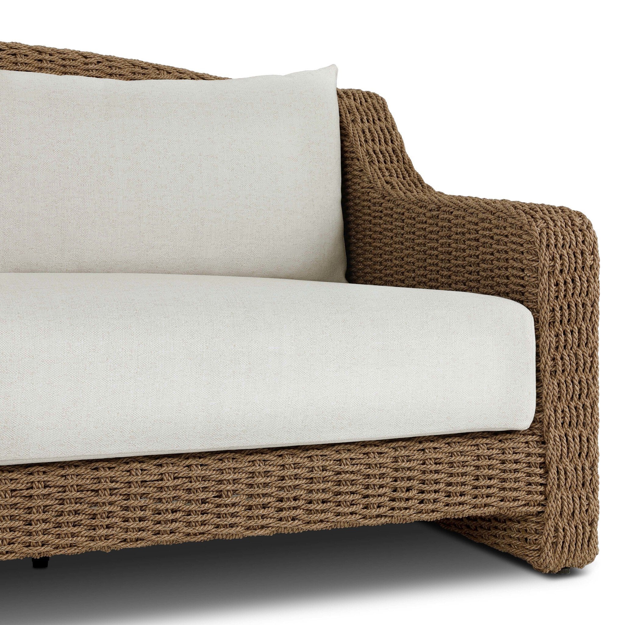 Four Hands Marina Outdoor Sofa in twisted umber faux rattan with Alessi Linen cushions, close-up detail of rattan weave, view 2