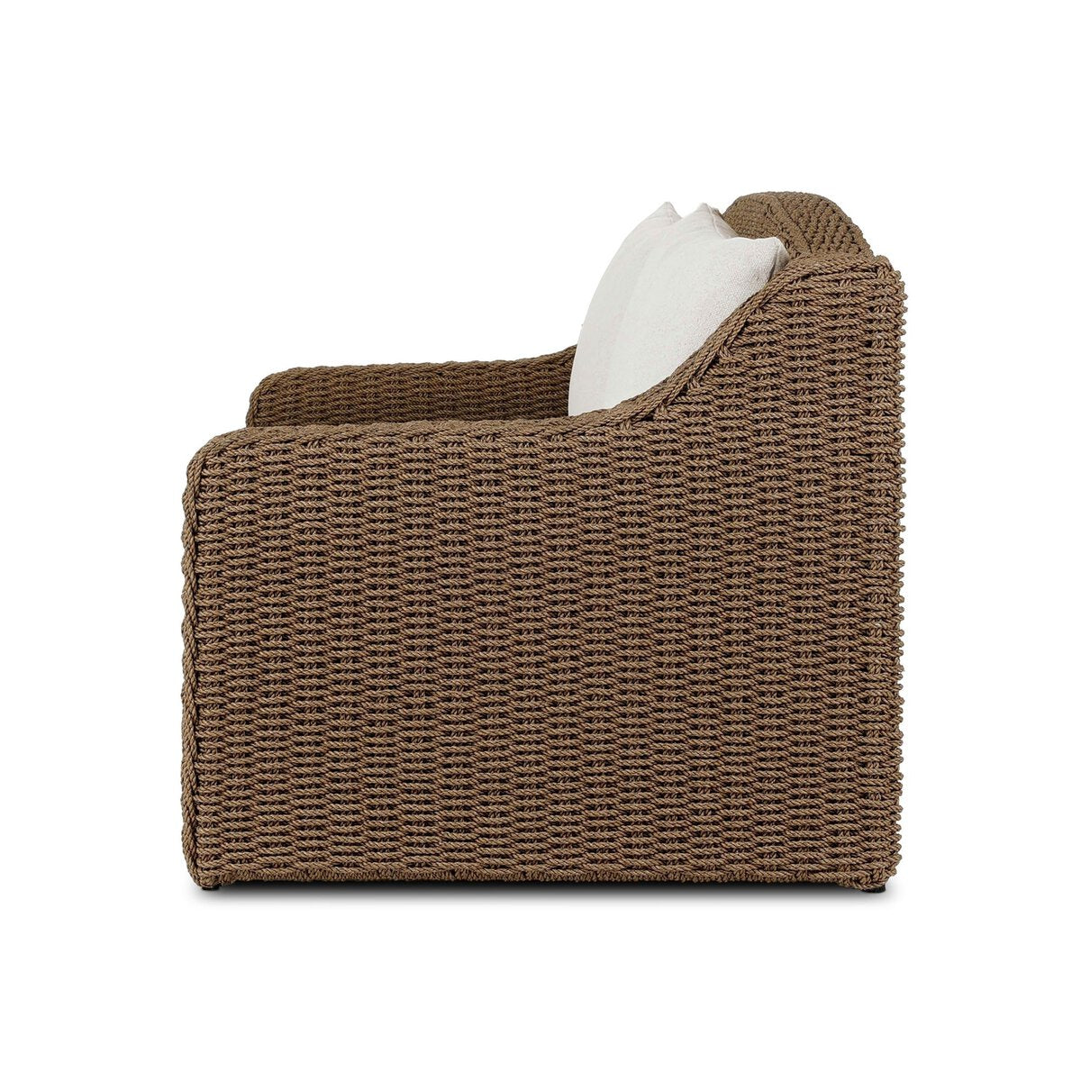 Four Hands Marina Outdoor Sofa in twisted umber faux rattan with Alessi Linen cushions, side profile view
