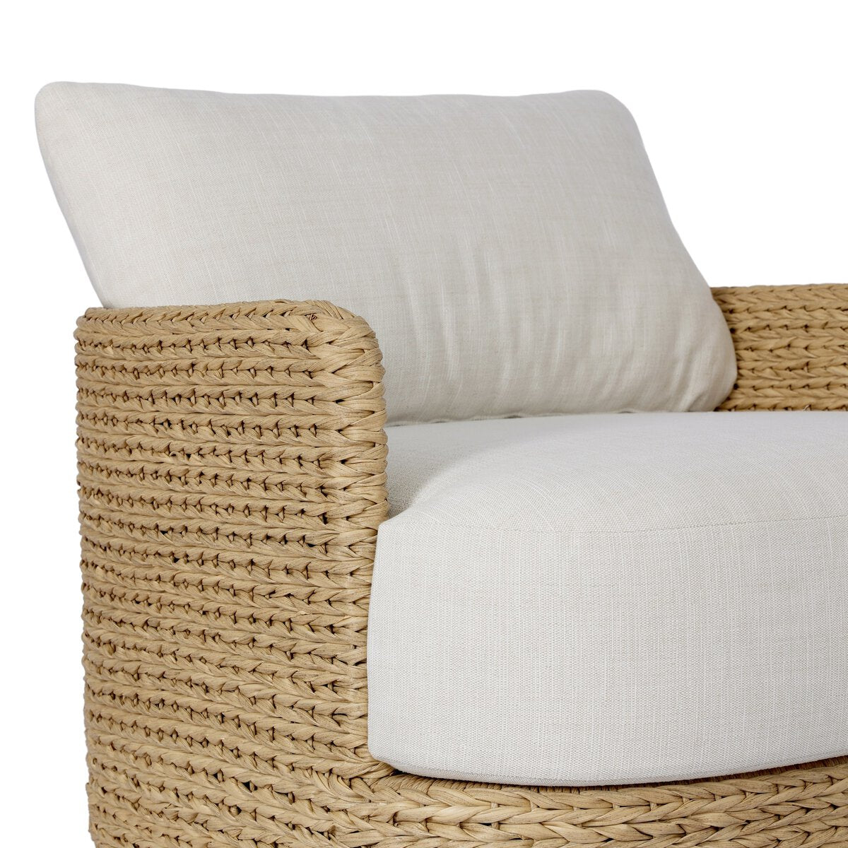 Four Hands Caney Outdoor Swivel Chair in coastal weave with cream cushion, close-up detail, view 1