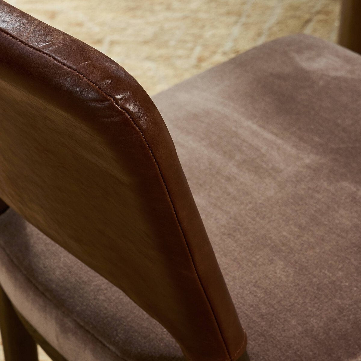 Four Hands Ryver Monte Mushroom Dining Chair Set of 2 with mahogany leather back on burnt ash, close-up detail of velvet seat, view 2