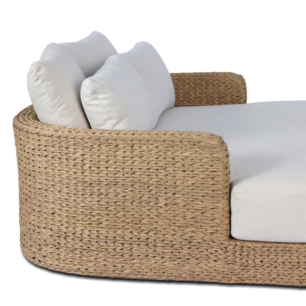 Four Hands Caney Outdoor Double Chaise in coastal weave with cream cushion, close-up detail, view 1
