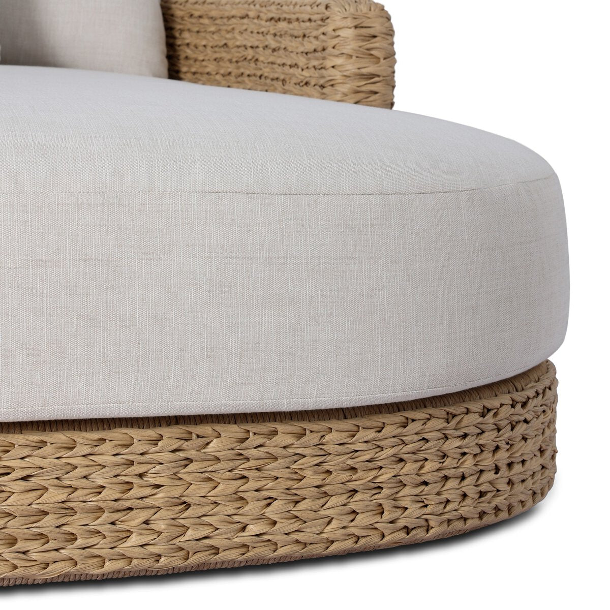Four Hands Caney Outdoor Double Chaise in coastal weave with cream cushion, close-up detail, view 3