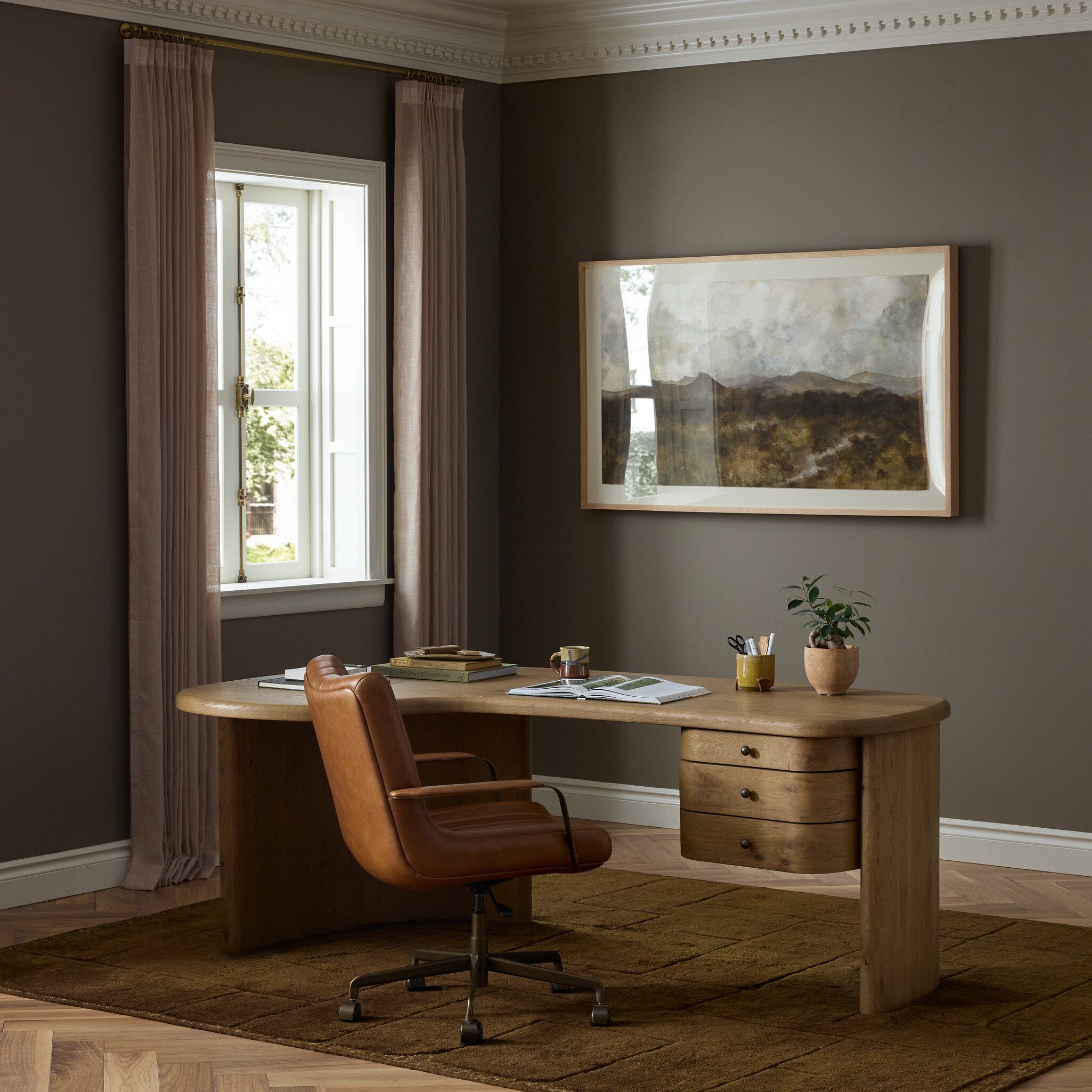 Four Hands Roan Aged Smoked Oak Desk in a styled room setting