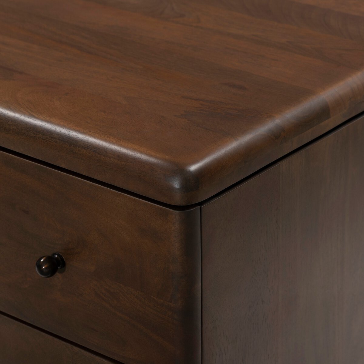 Four Hands Eldrin Nightstand in warm brown mango with antique brass hardware, close-up detail of drawer and brass, view 4