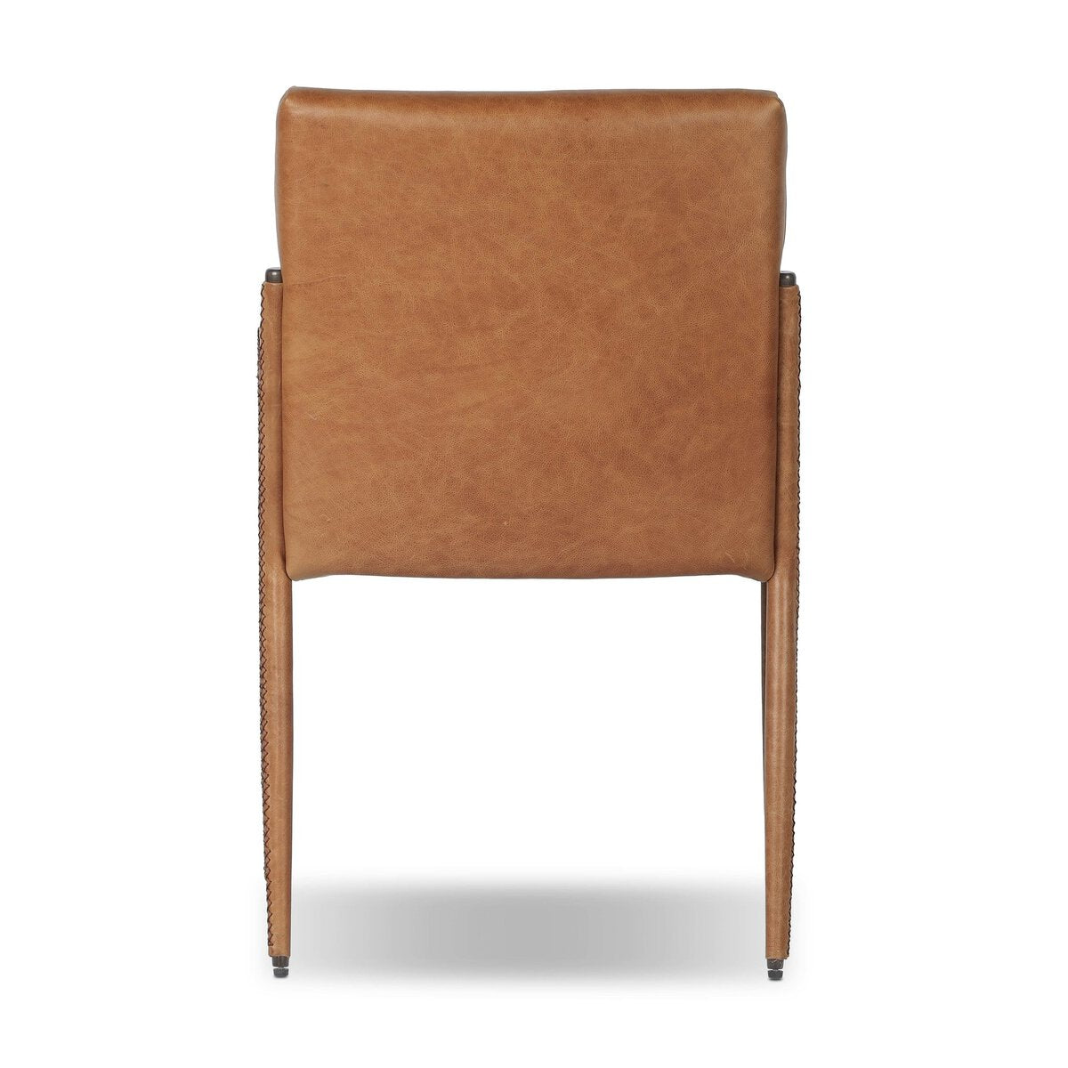 Four Hands Quill Dining Armchair in Chaps Saddle leather with leather-wrapped iron legs, back view