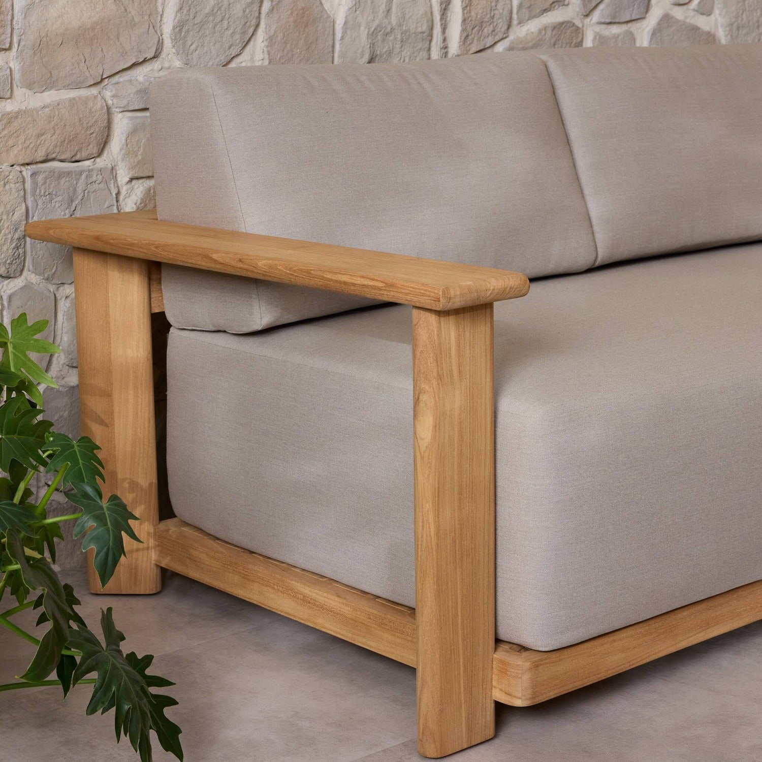 Four Hands Sterling Ibiza Mole 98in Outdoor Sofa in golden teak with mocha acrylic cushions, alternate styled view