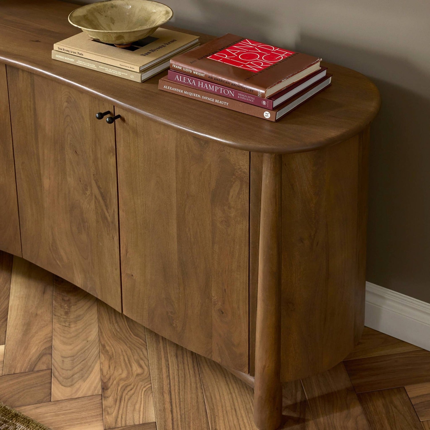 Four Hands Tindra Washed Taupe Sideboard in curved solid mango with tapered legs, alternate styled view
