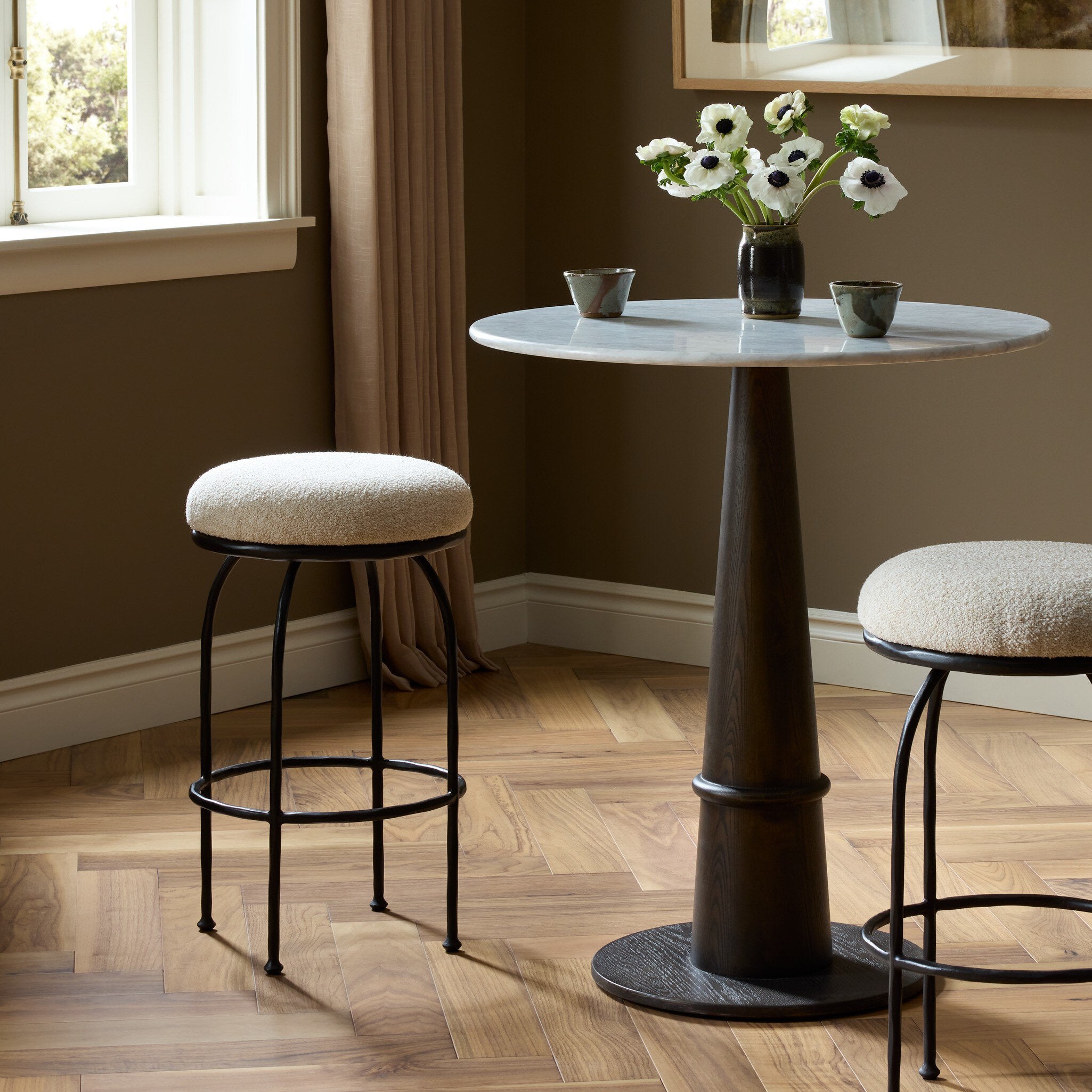 Four Hands Larisa Yuma Cream Swivel Counter Stool styled in a room setting