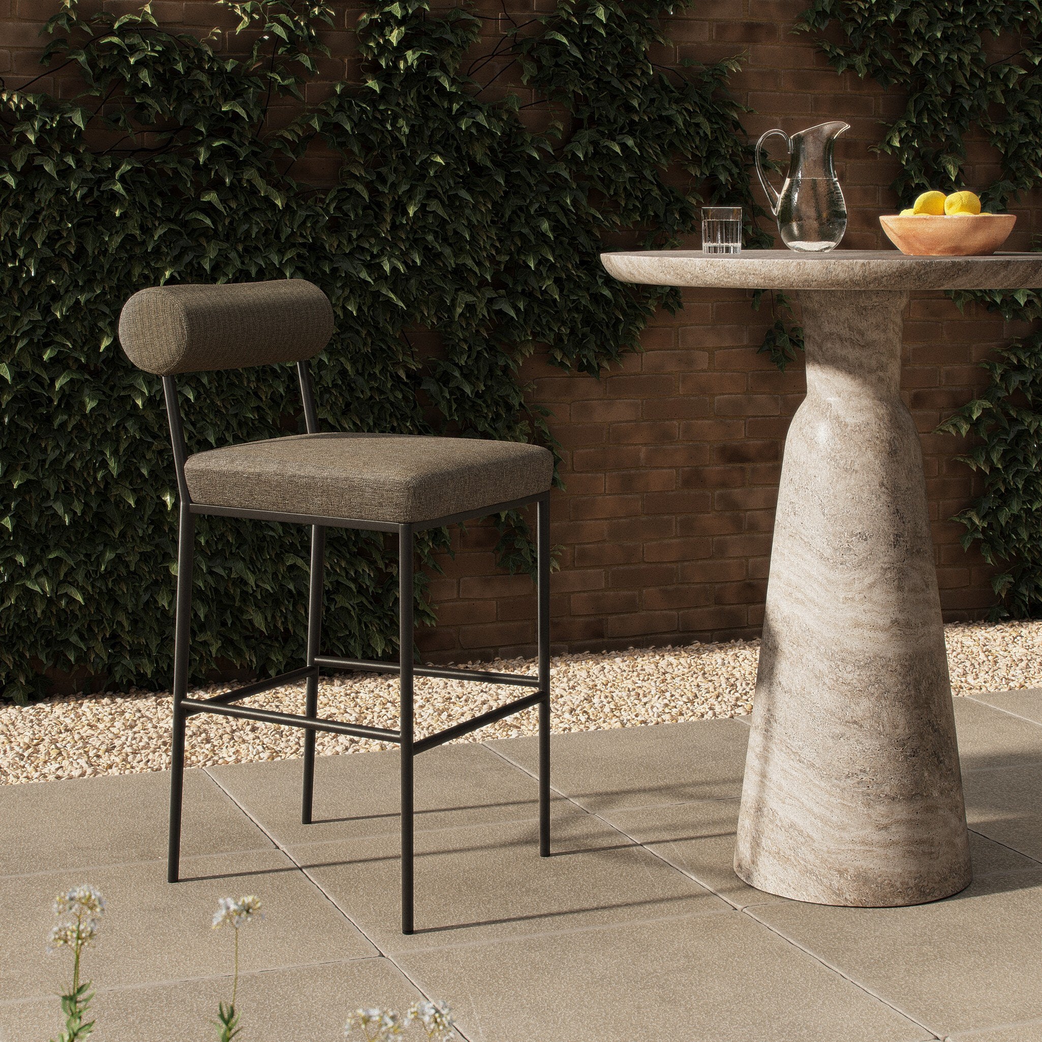 Four Hands Brookline Alessi Fawn Outdoor Bar Stool styled in a room setting