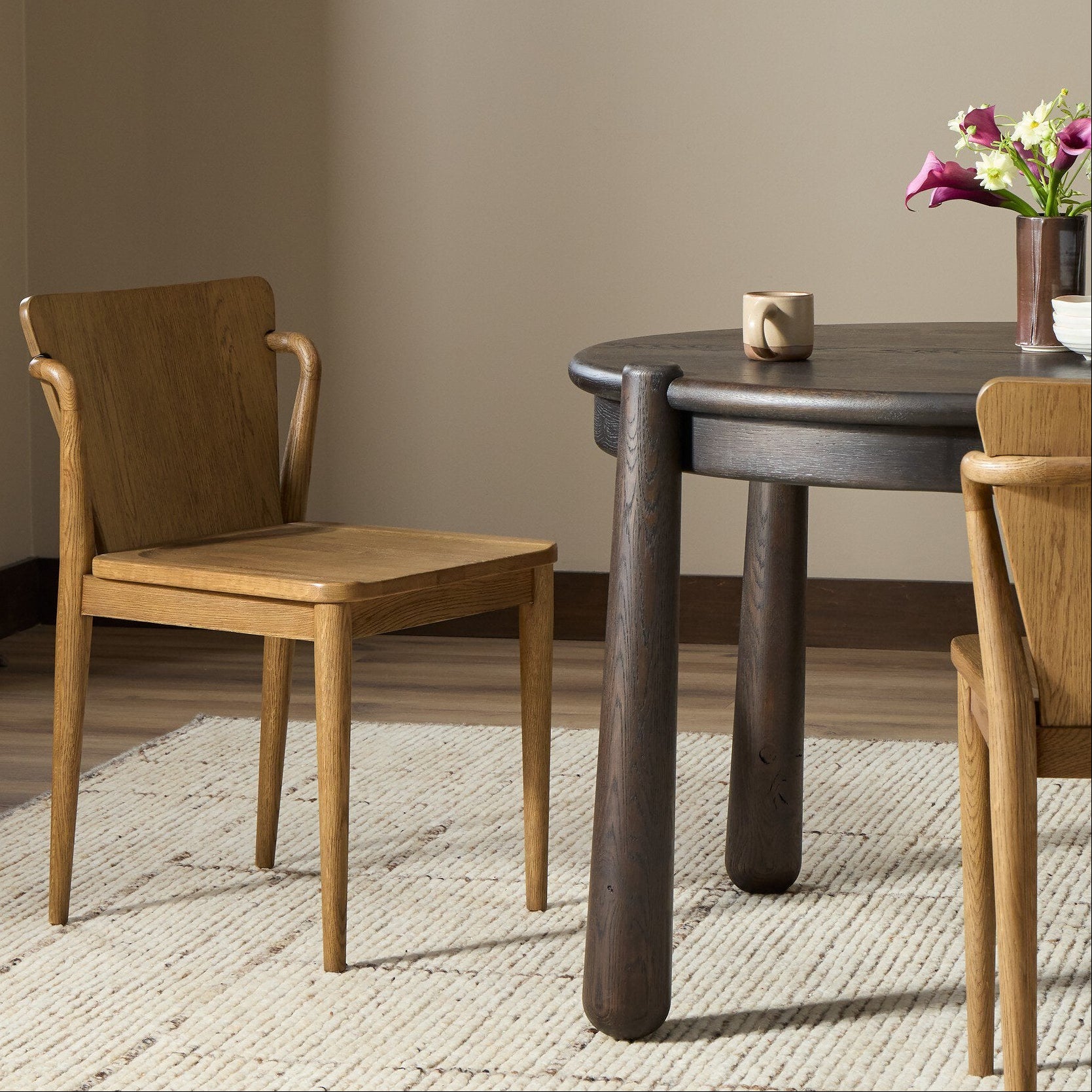 Four Hands Ankeny Amber Oak Dining Chair styled in a room setting