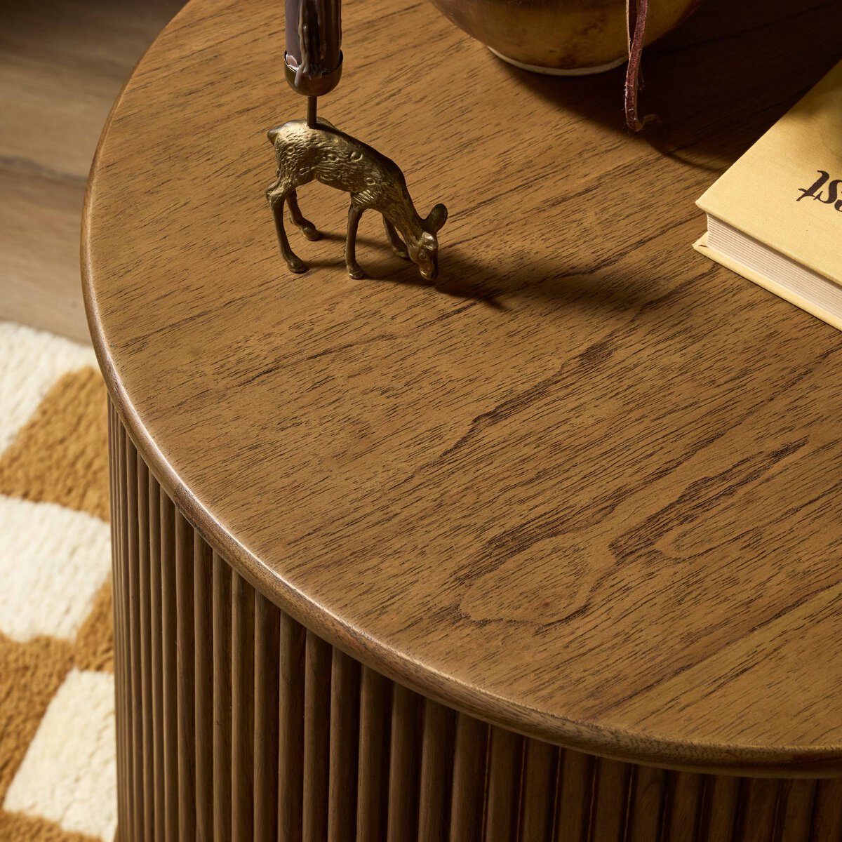 Four Hands Ona End Table in amber mindi veneer with carved reeding, close-up detail of reeding, view 1
