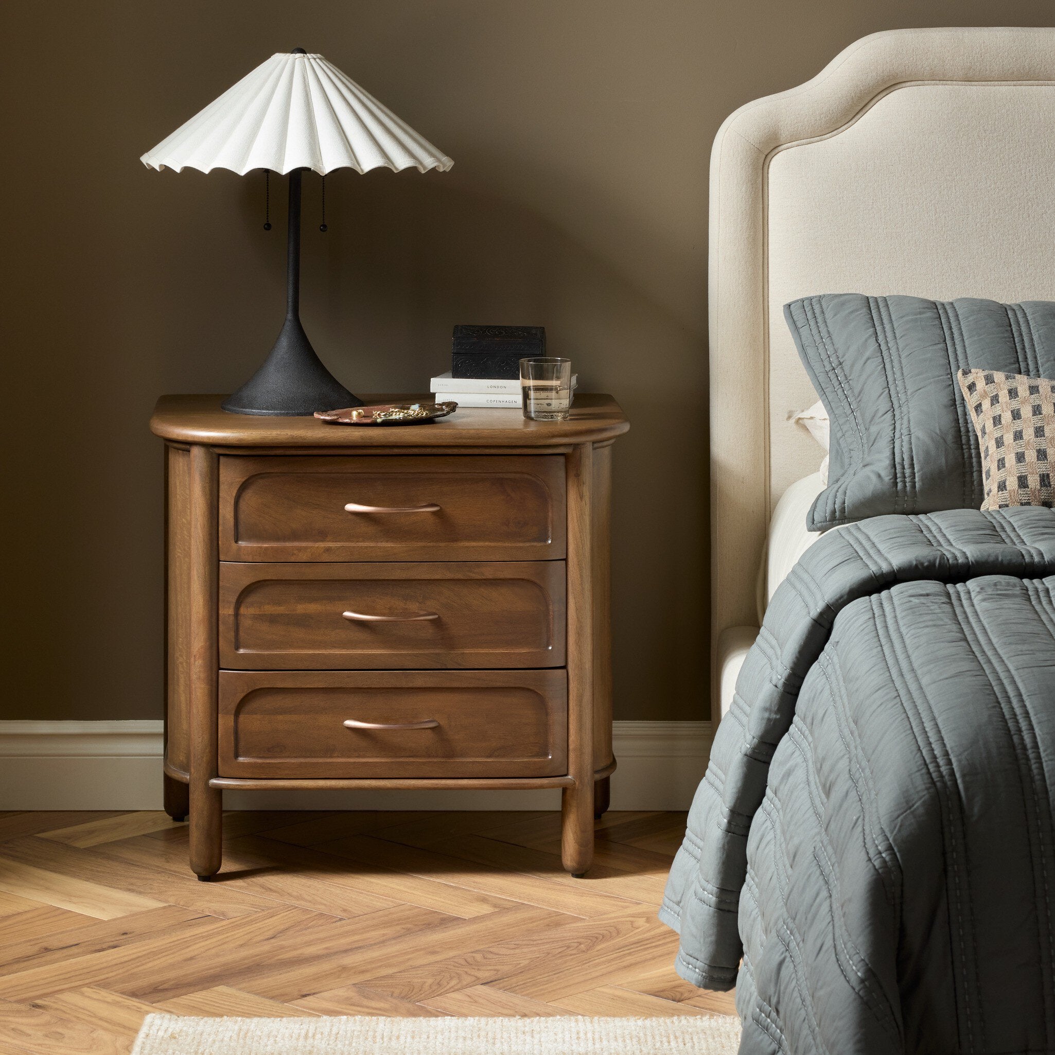 Four Hands Divion Warm Brown Mango Nightstand styled in a room setting