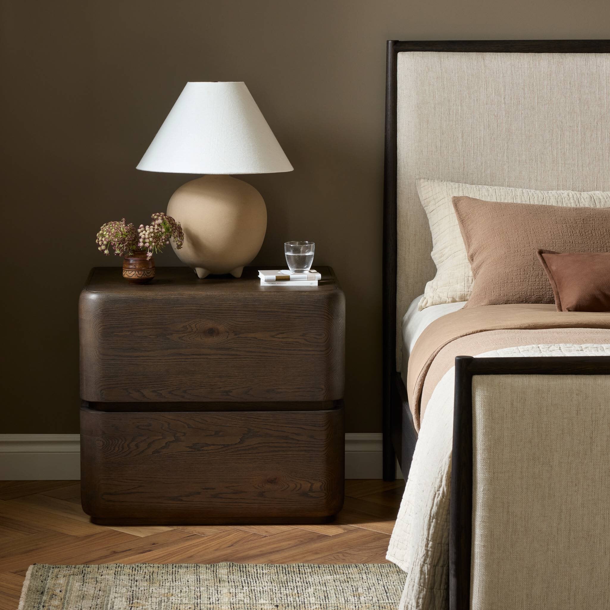 Four Hands Trona Tobacco Oak Nightstand styled in a room setting