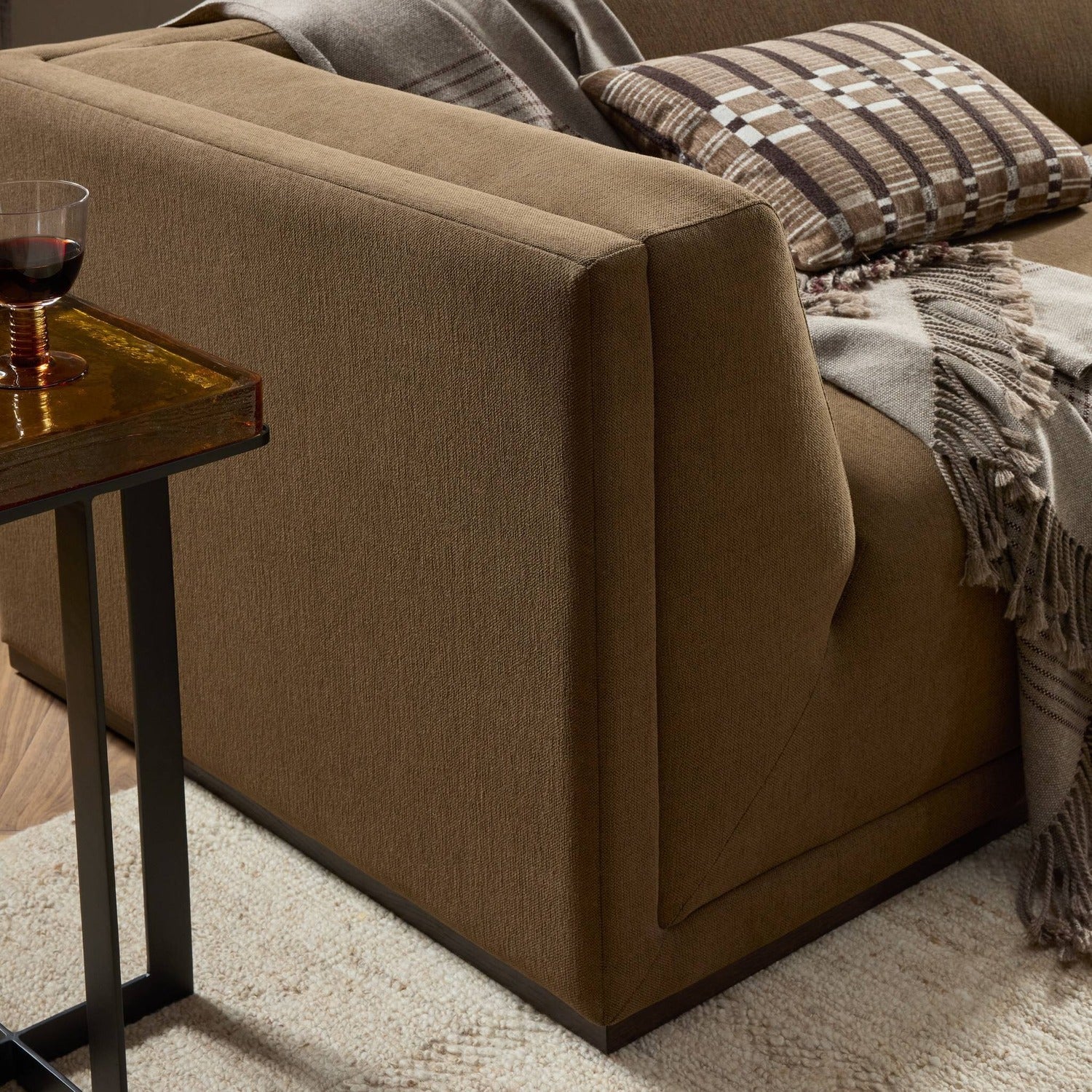 Four Hands Vince Crypton Nomad Mushroom 94in Tuxedo Sofa on wood plinth, alternate styled view