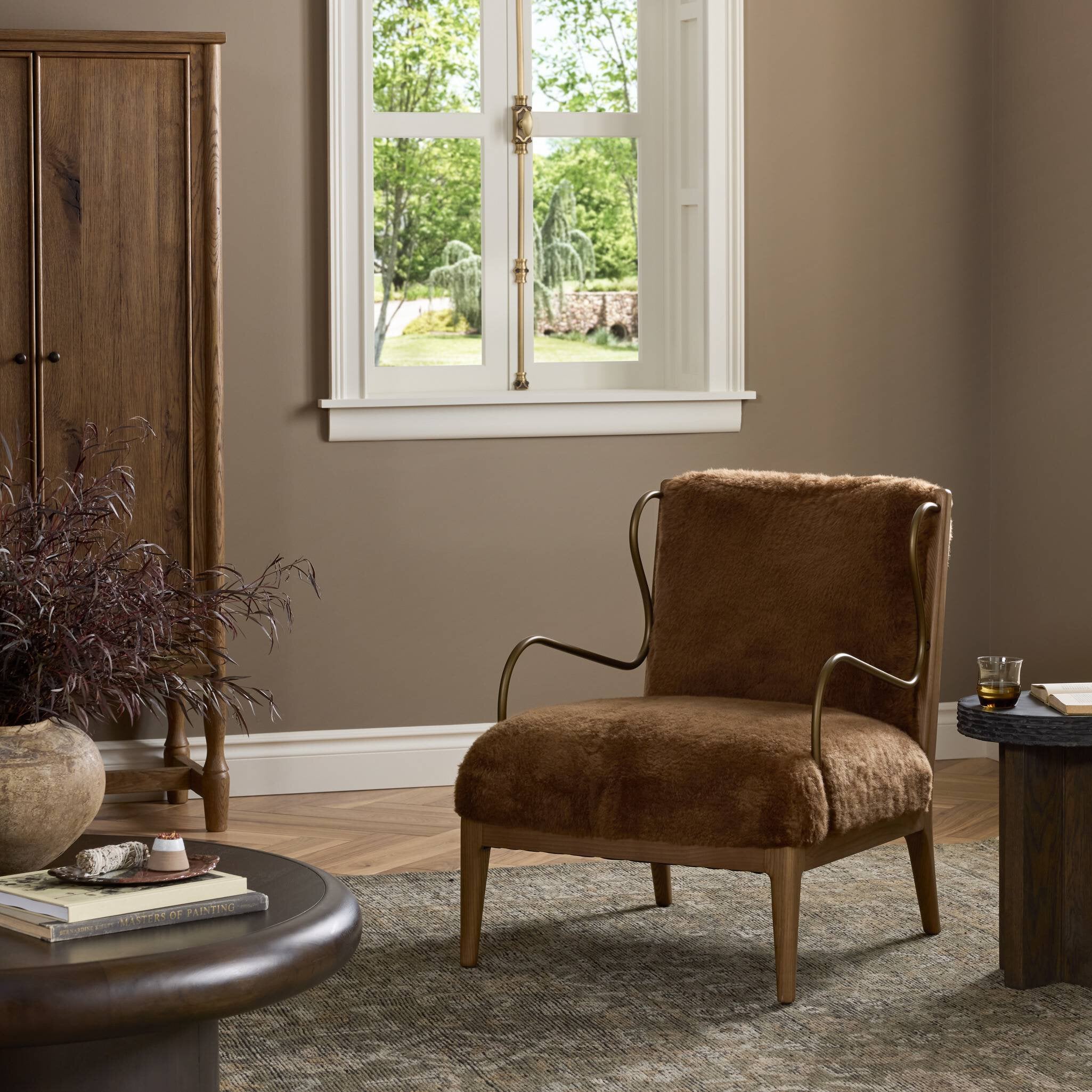 Four Hands Yesenia Ochre Shearling Chair styled in a room setting