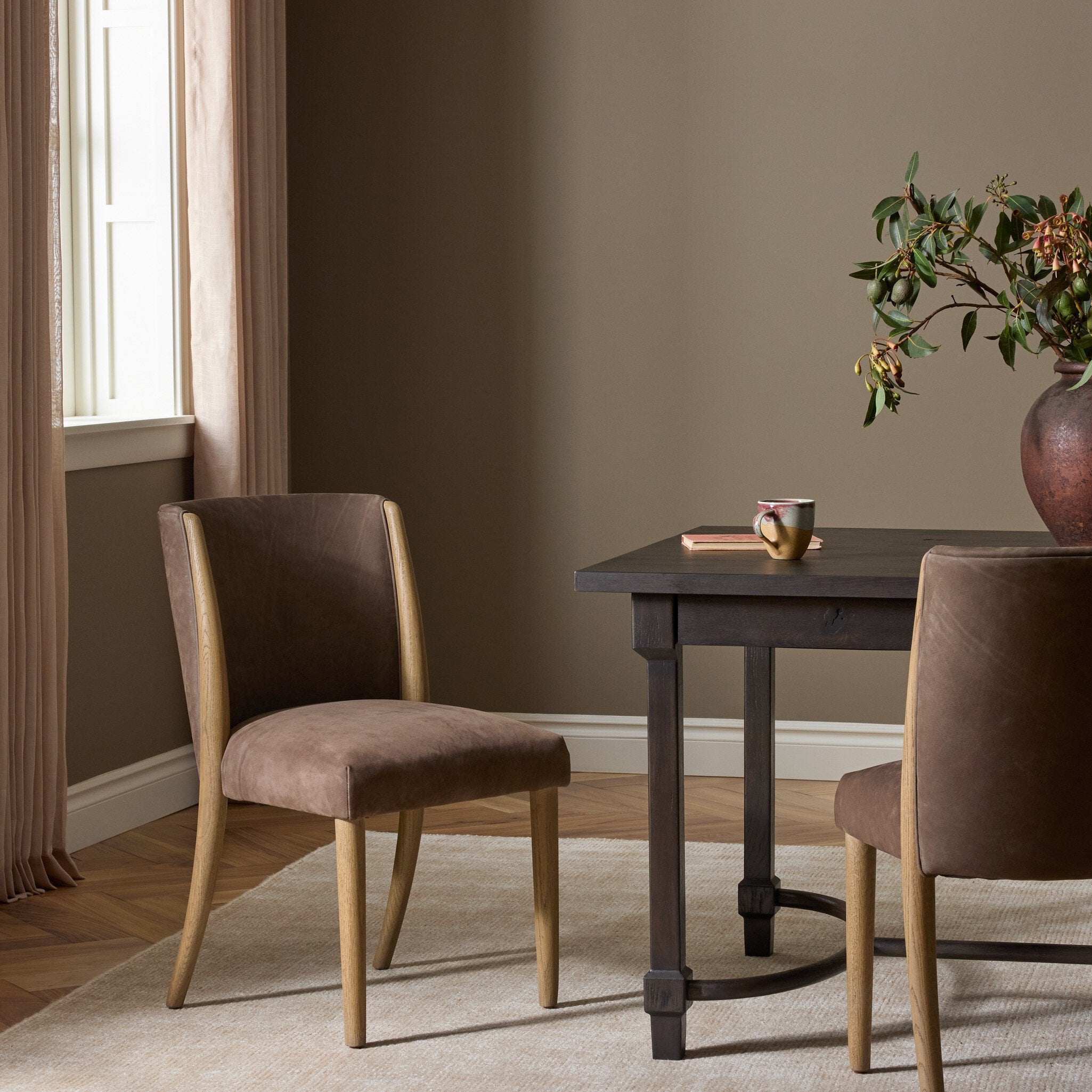 Four Hands Marela Nubuck Cigar Dining Chair in a styled room setting