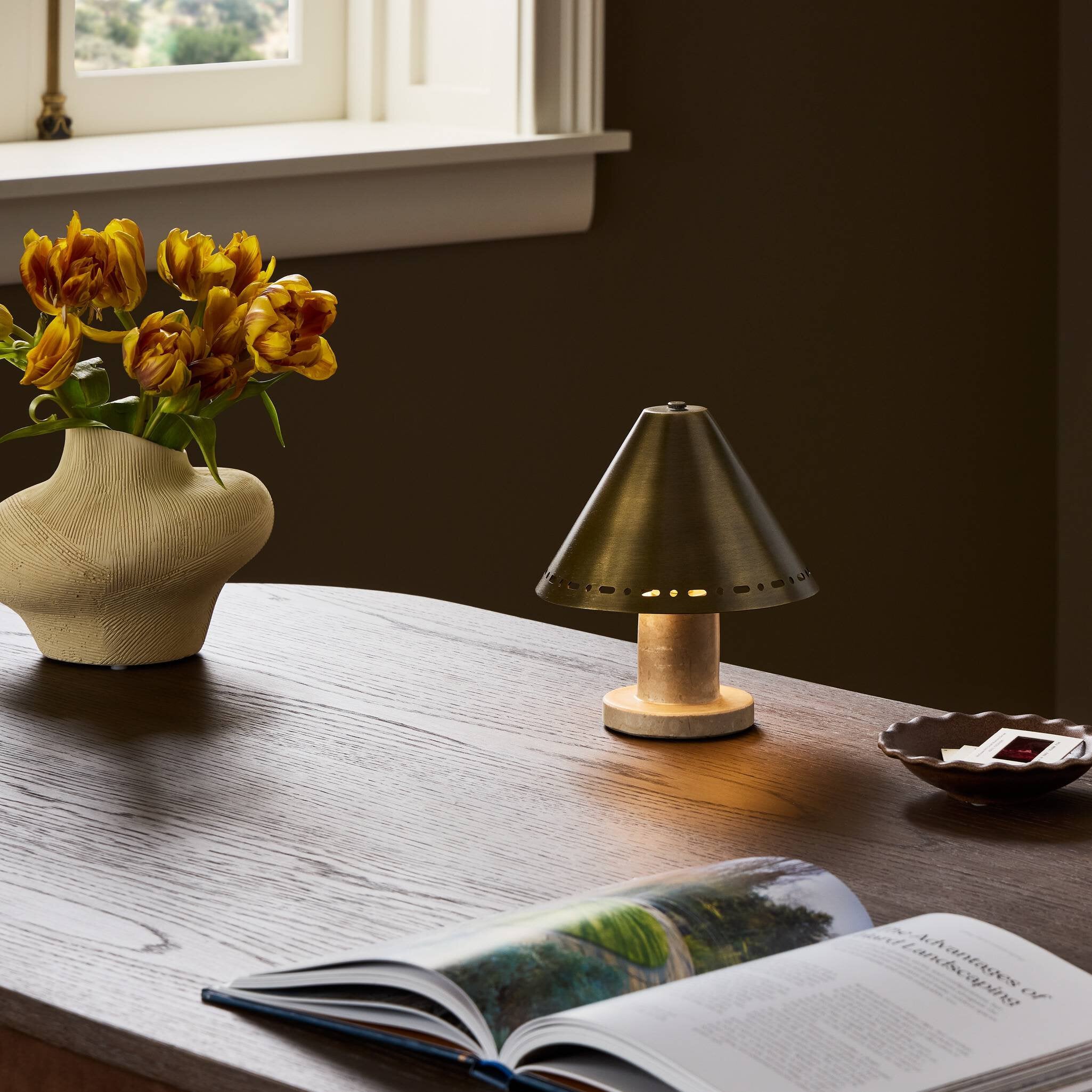 Four Hands Azra Cream Italian Marble Cordless Table Lamp in a styled room setting
