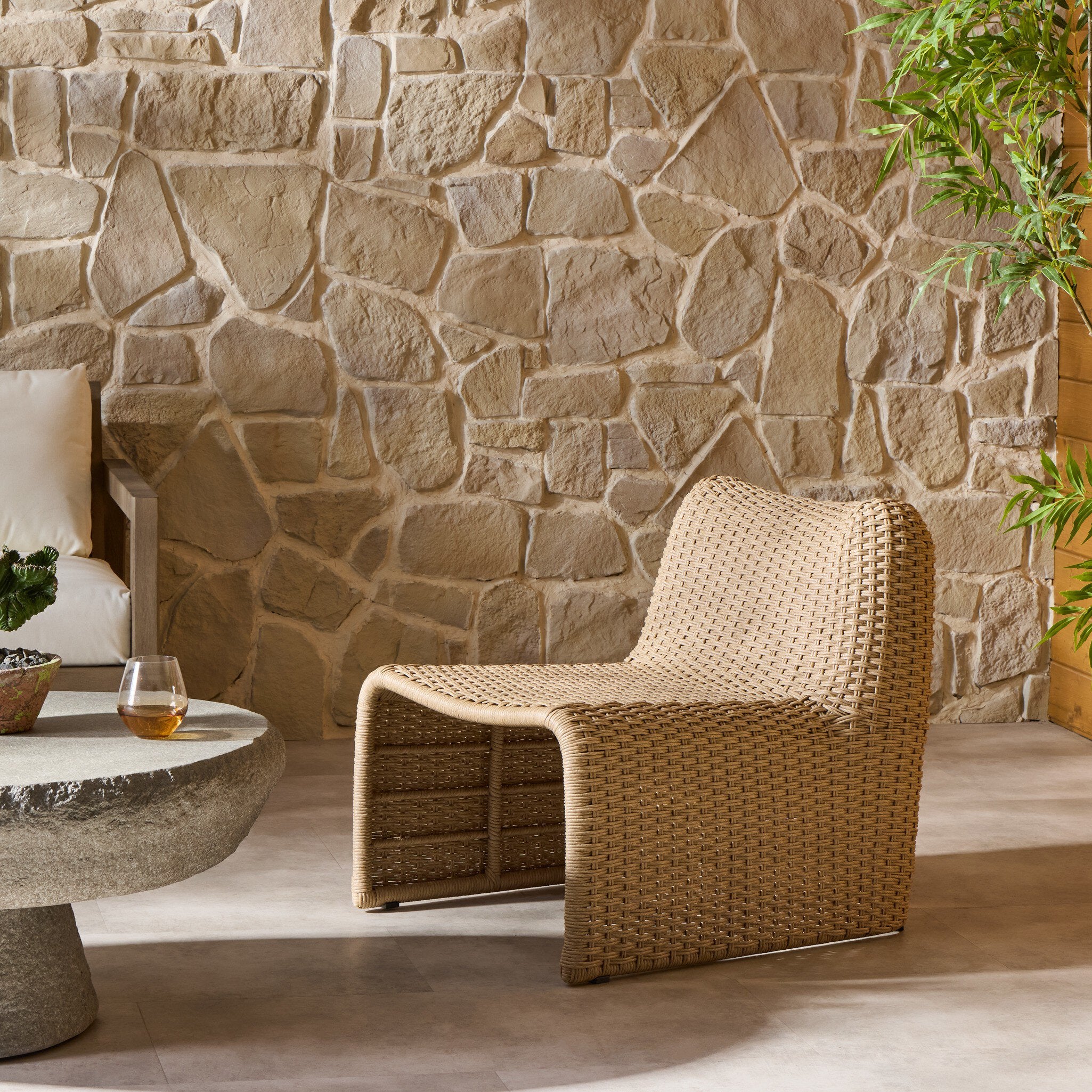 Four Hands Dominico Twisted Harvest Outdoor Single Chair in a styled room setting