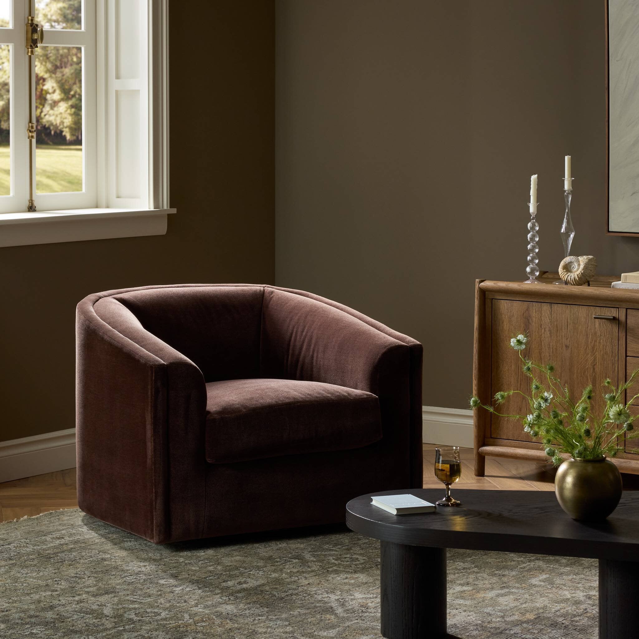 Four Hands Presley Monte Chocolate Swivel Chair styled in a room setting