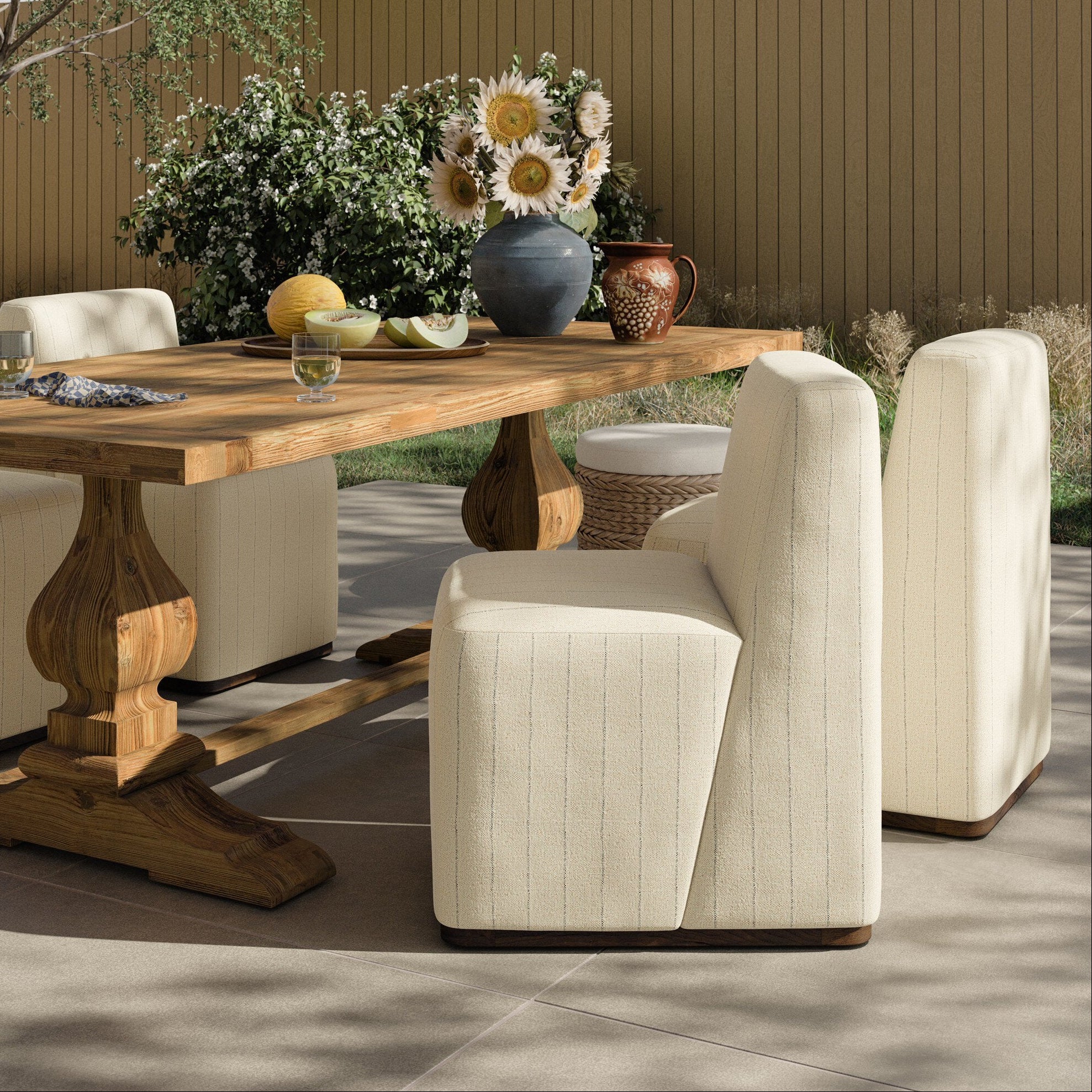 Four Hands Almere Amalfi Natural Outdoor Dining Chair styled in a room setting