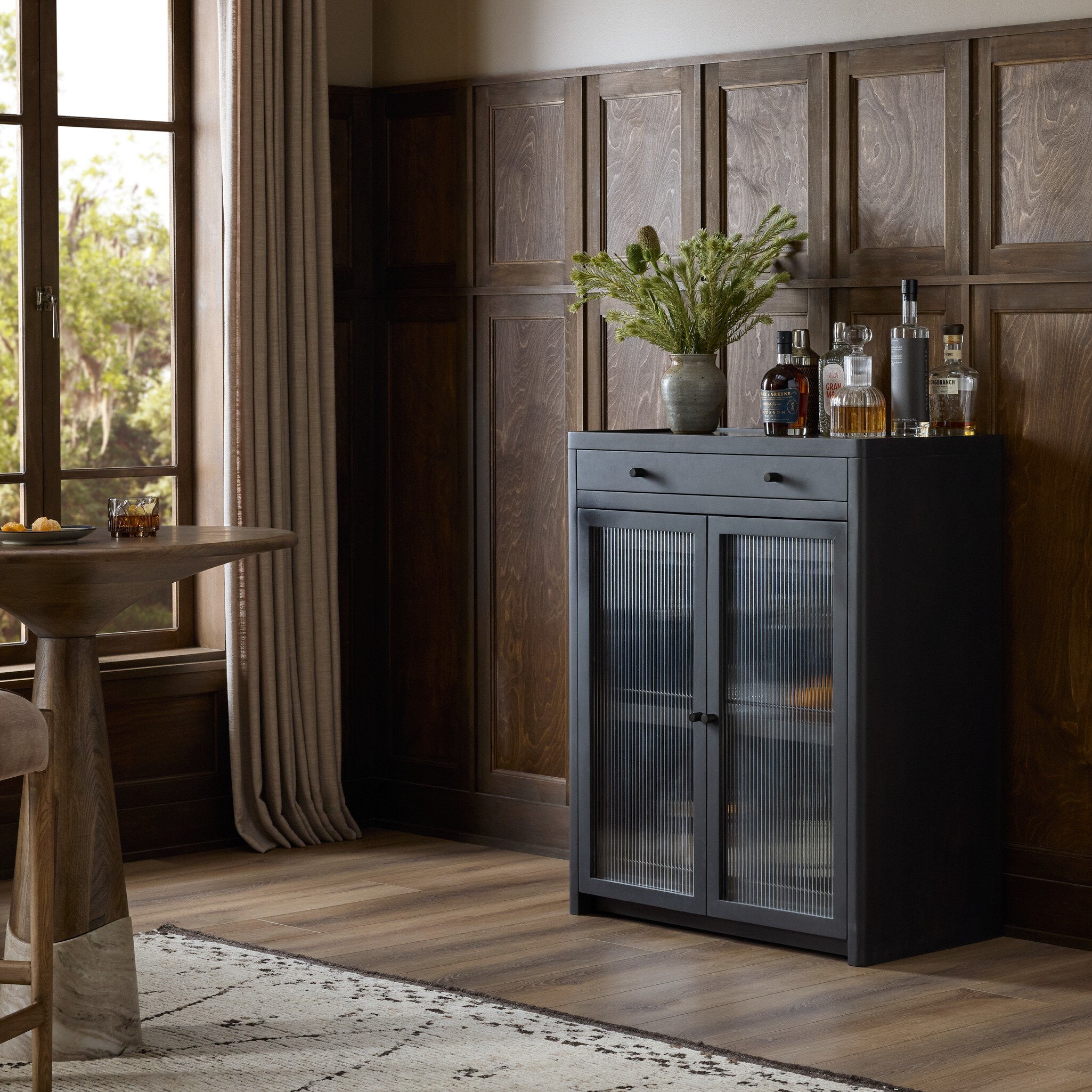 Four Hands Santiago Smoked Black Mango Bar Cabinet styled room setting 2