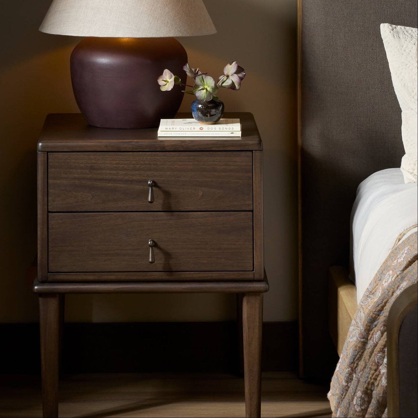Four Hands Zaria Dark Brown Sungkai Nightstand styled in a room setting
