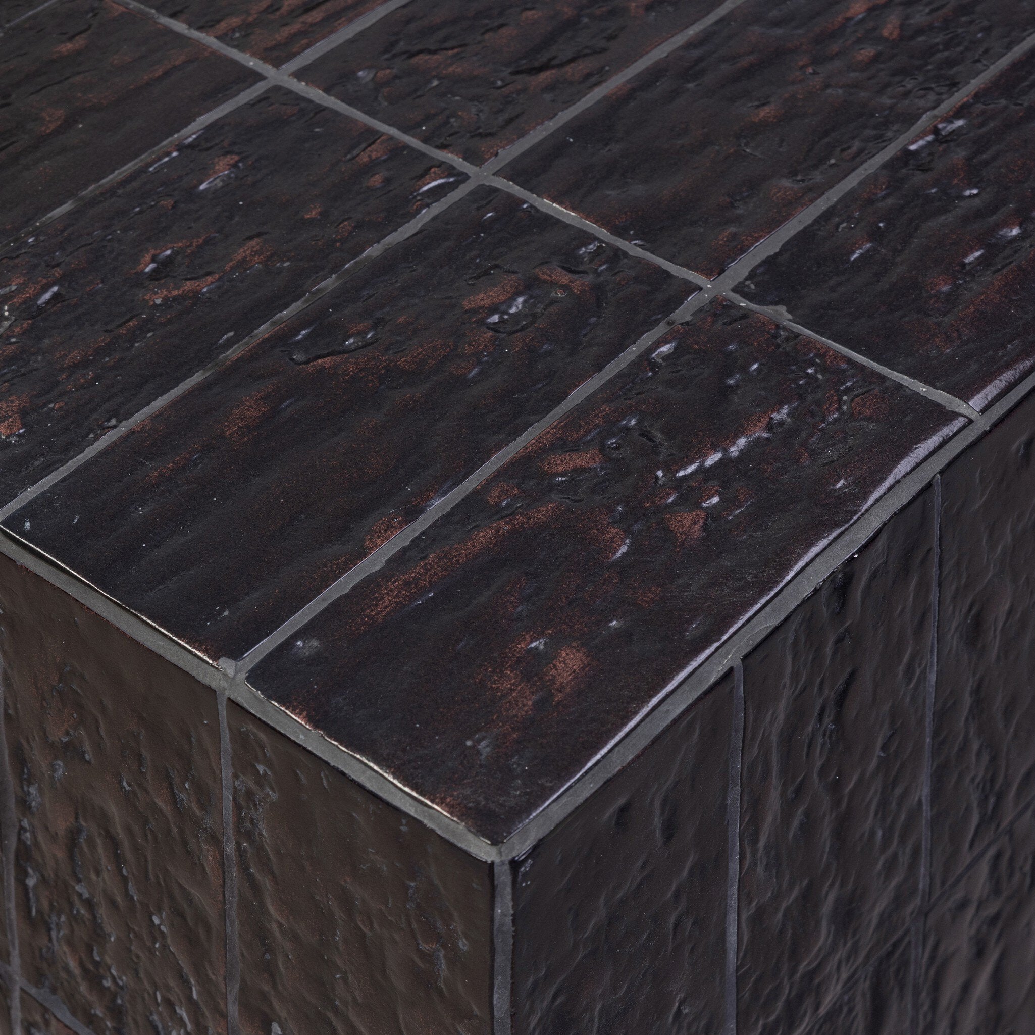 Four Hands Tanik Textured Brown Tile Coffee Table — close-up of the surface