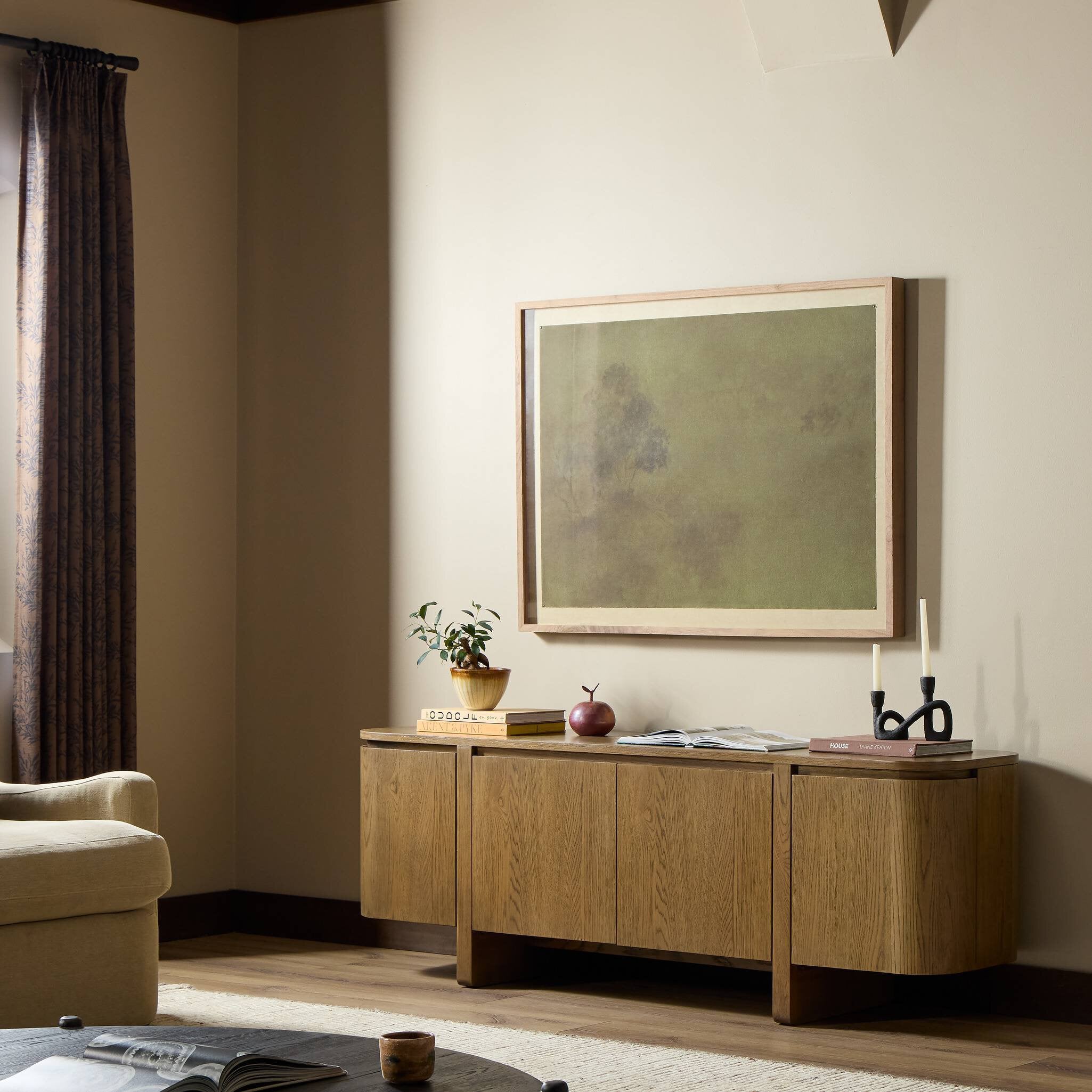 Four Hands Elle Tawny Oak 4 Door Media Console — in a styled room setting